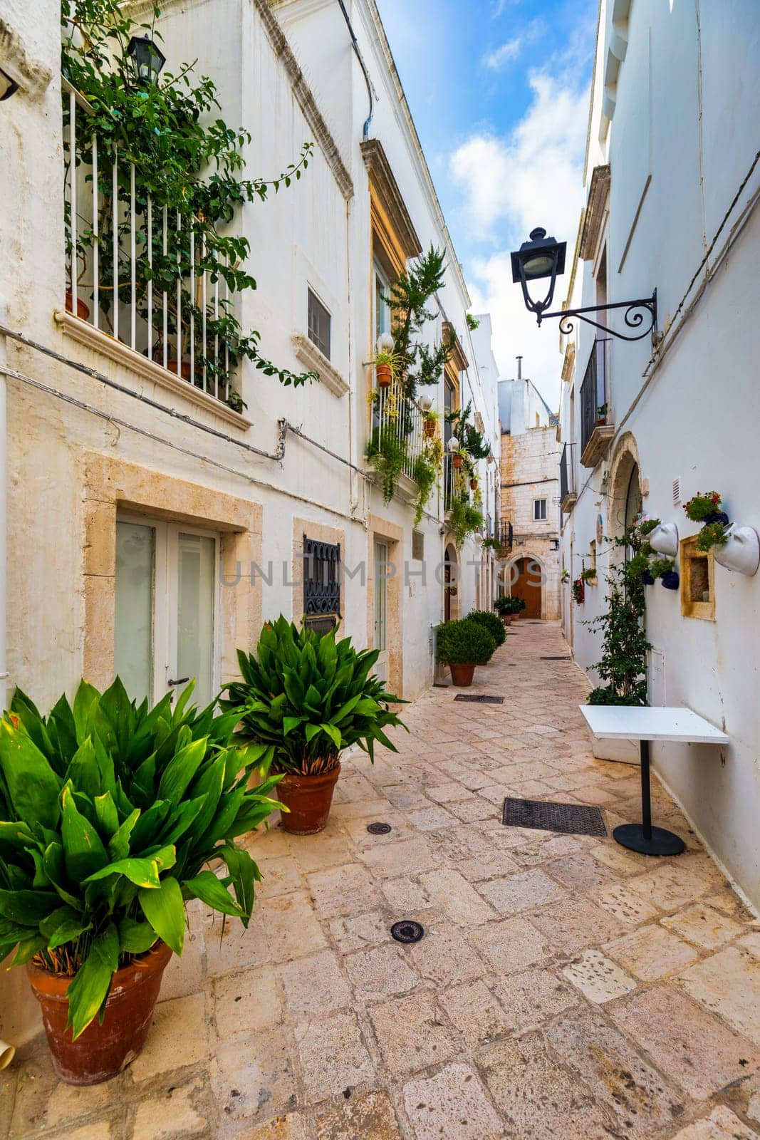 Scenic sight in Locorotondo, Bari Province, Apulia (Puglia), Italy. Characteristic streets in the Locorotondo in Puglia, Italy. Locorotondo is a town of the Metropolitan City of Bari, Apulia, Italy.