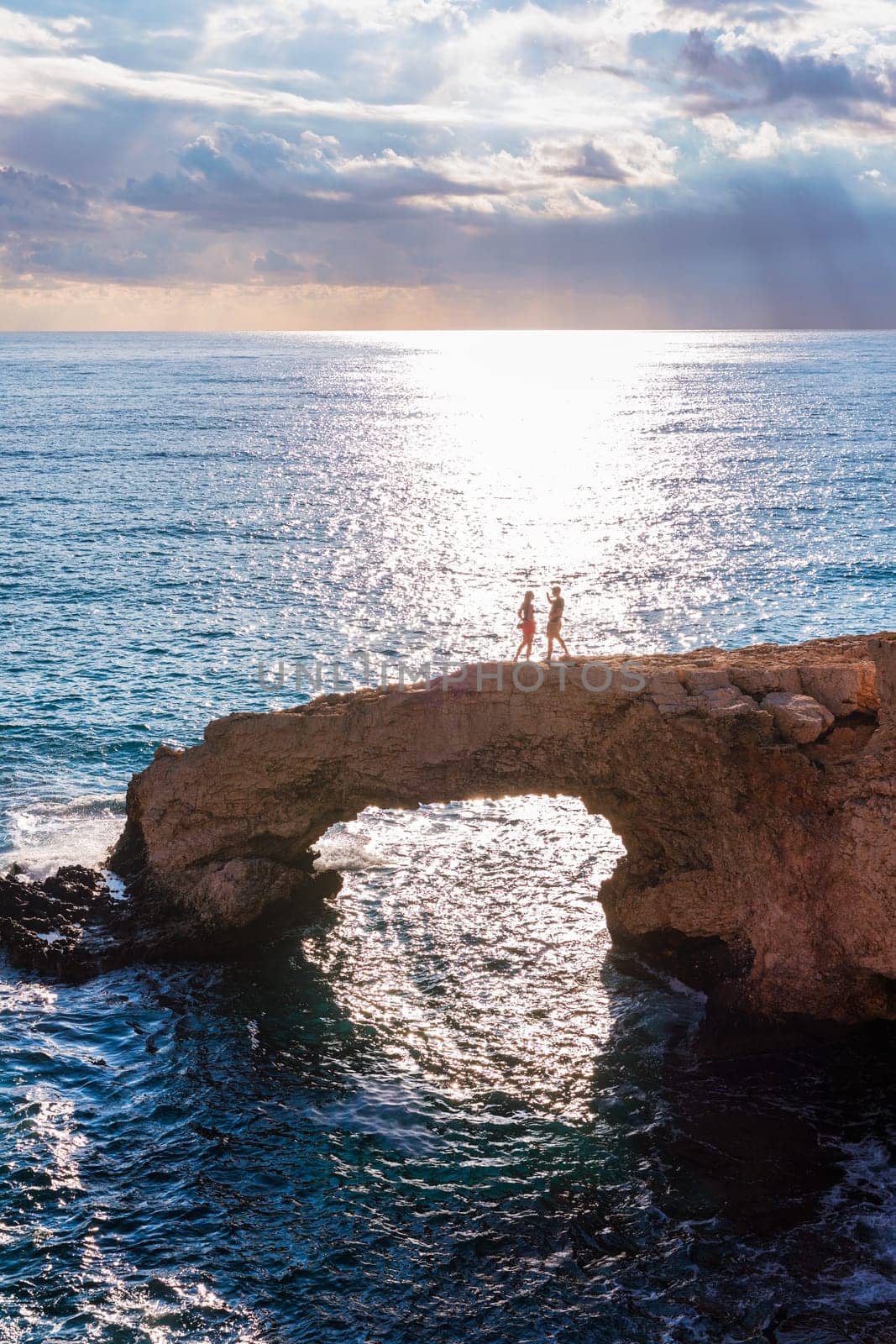 Beautiful bridge of lovers natural rock arch near of Ayia Napa, Cavo Greco and Protaras on Cyprus island, Mediterranean Sea. Legendary bridge lovers. Amazing blue green sea and sunny day