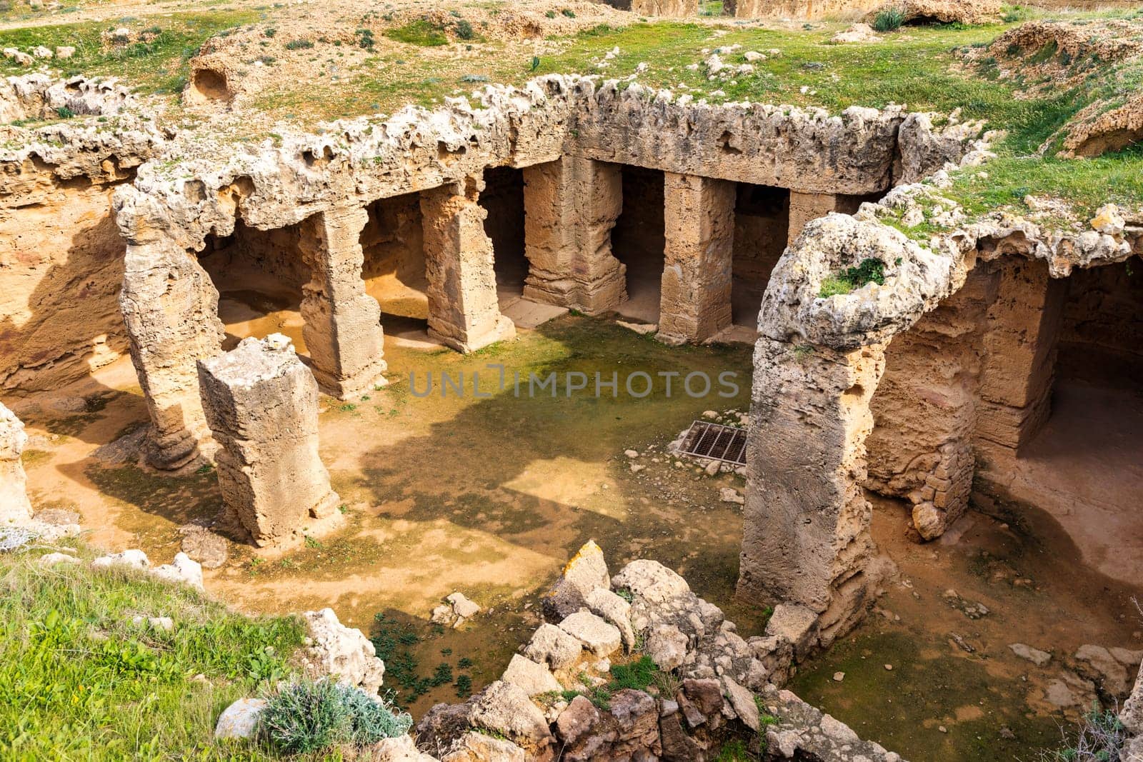 Cyprus. Pathos. Tombs of the Kings. Paphos Royal antique necropolis. Underground hall with columns under the open sky. Paphos archaeological memorial. Touristic sightseeing Cyprus. Travel to Cyprus. by DaLiu