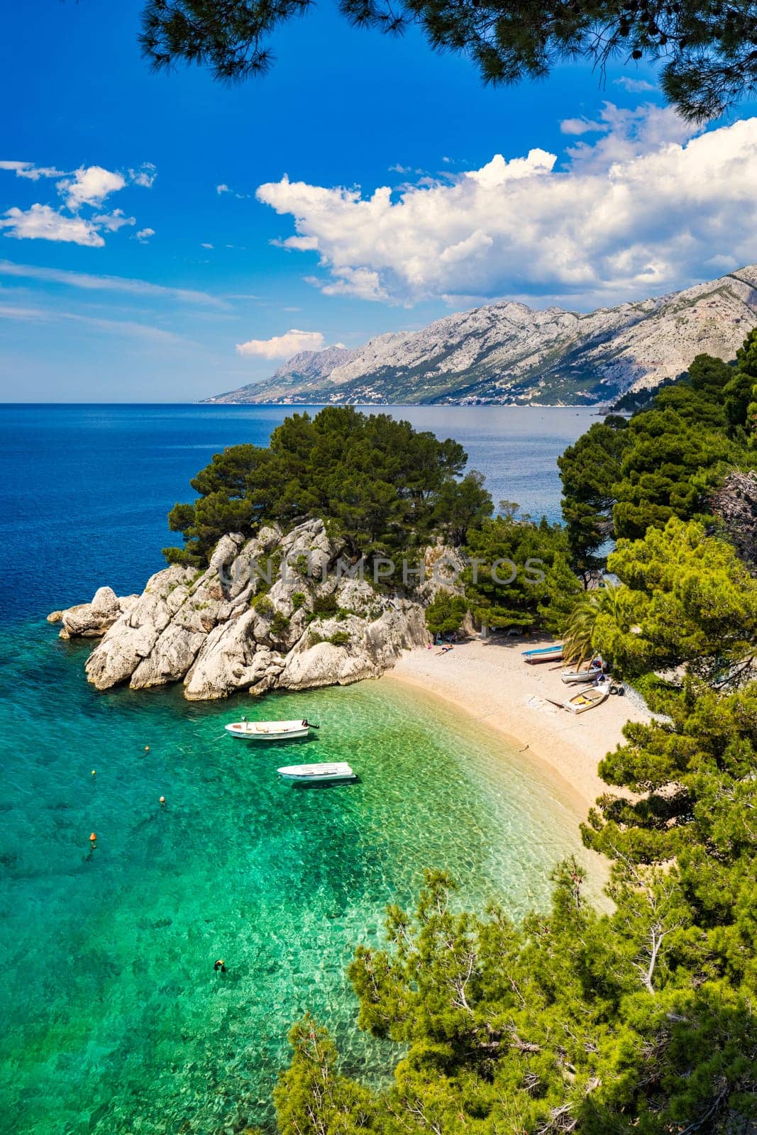 Amazing aerial view of the beautiful Podrace beach in Brela, Makarska Riviera, Croatia. Aerial view of Podrace beach and waterfront on Makarska riviera, Brela, Dalmatia region of Croatia.