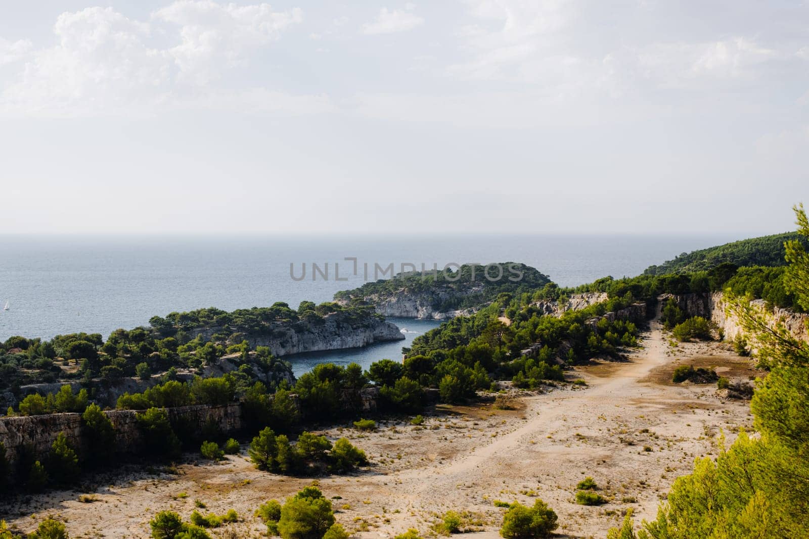 Beautiful view of rocky mountains with vegetation and bays in the Mediterranean sea on an autumn day in the calanques in France, close-up side view with depth of field.