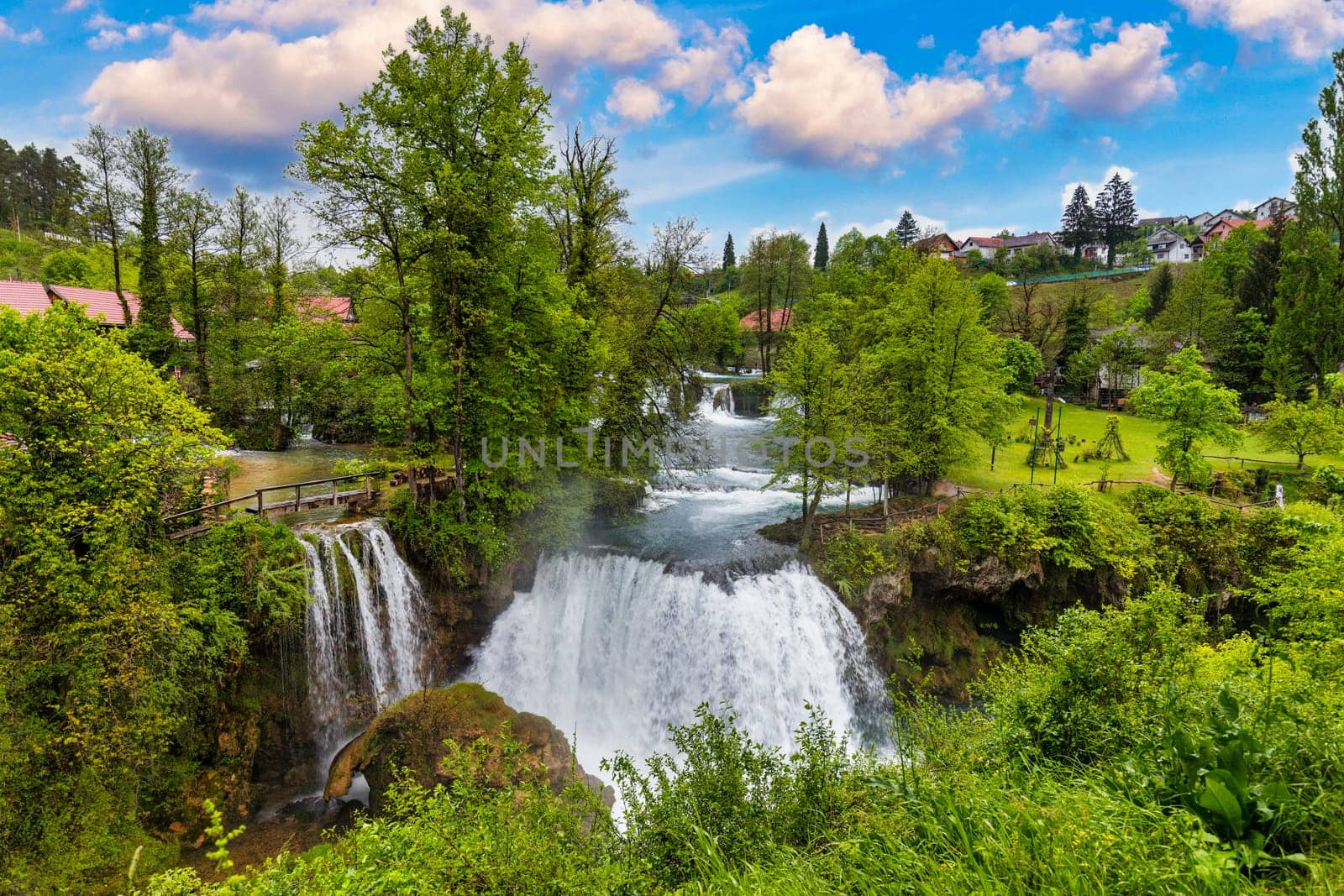 Village of Rastoke near Slunj in Croatia, old water mills on waterfalls of Korana river, beautiful countryside landscape. Landscape with river and little waterfalls in Rastoke village, Croatia.