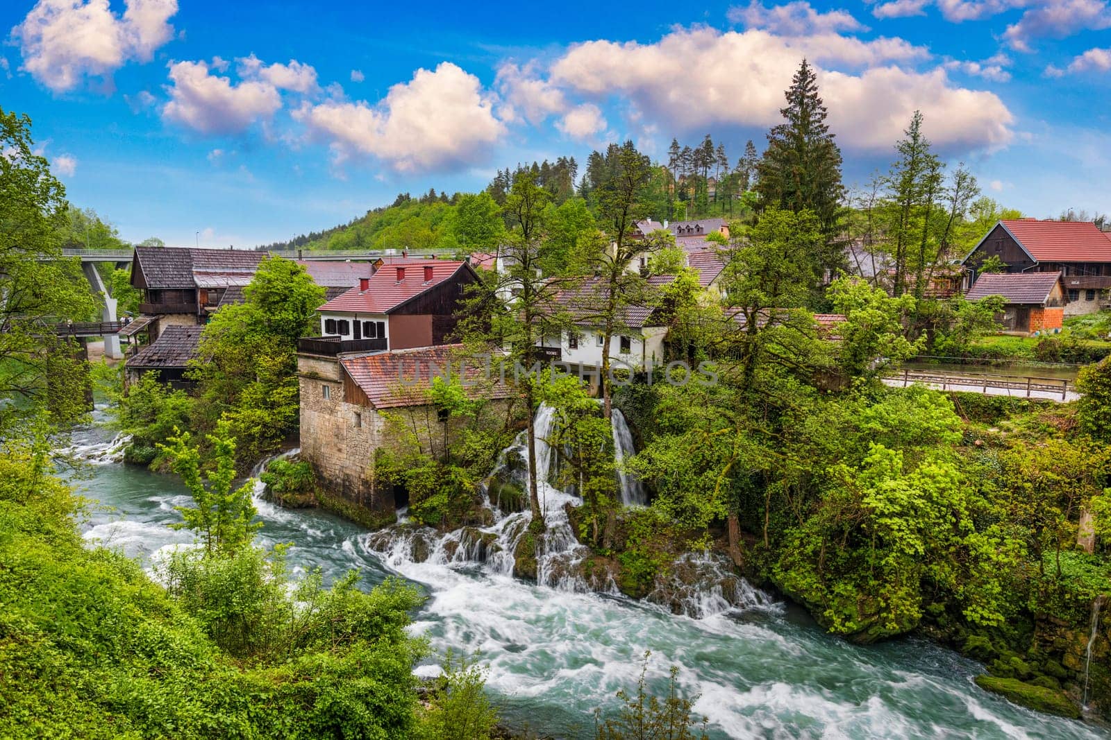 Village of Rastoke near Slunj in Croatia, old water mills on waterfalls of Korana river, beautiful countryside landscape. Landscape with river and little waterfalls in Rastoke village, Croatia.