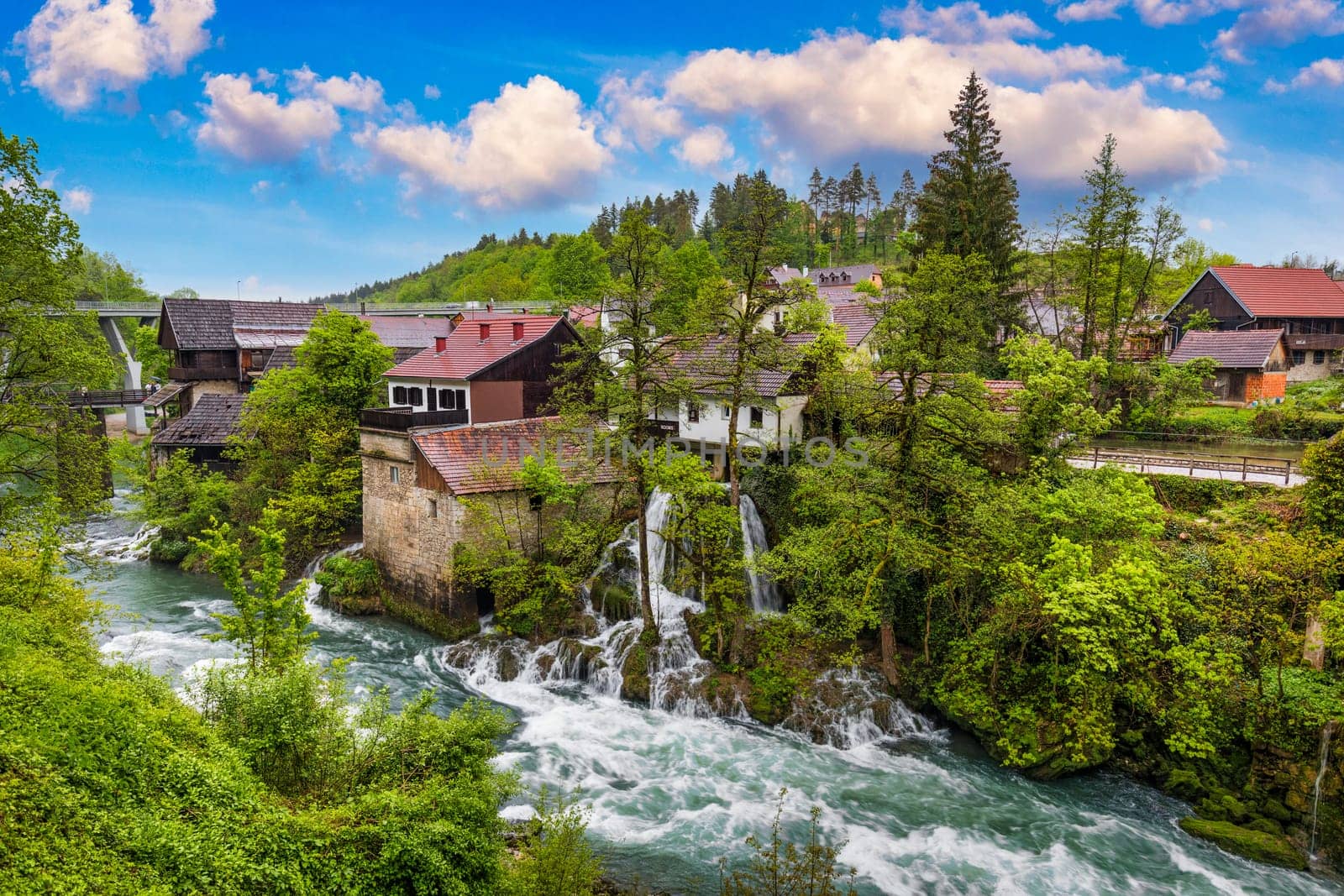 Village of Rastoke near Slunj in Croatia, old water mills on waterfalls of Korana river, beautiful countryside landscape. Landscape with river and little waterfalls in Rastoke village, Croatia.