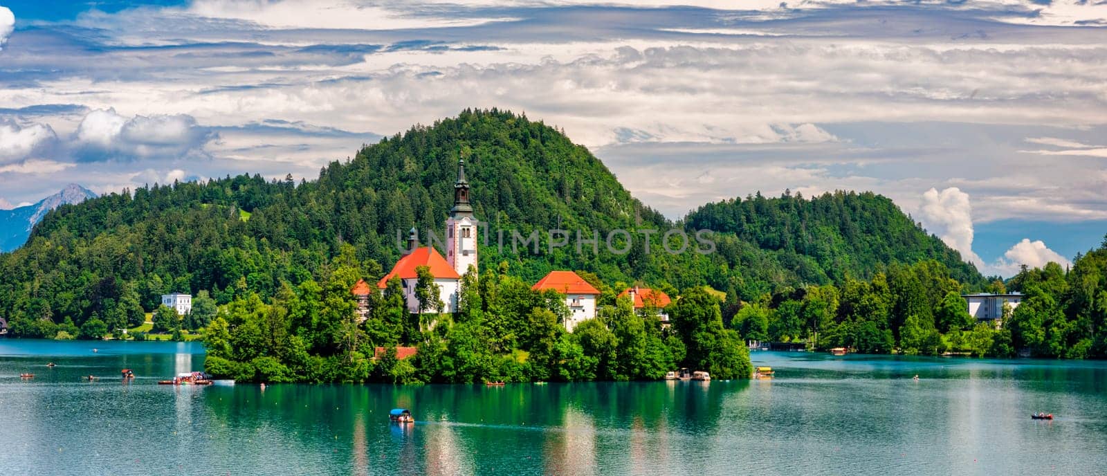 Lake Bled in Slovenia. Beautiful mountains and Bled lake with small Pilgrimage Church. Bled lake and island with Pilgrimage Church of the Assumption of Maria. Bled, Slovenia, Europe.