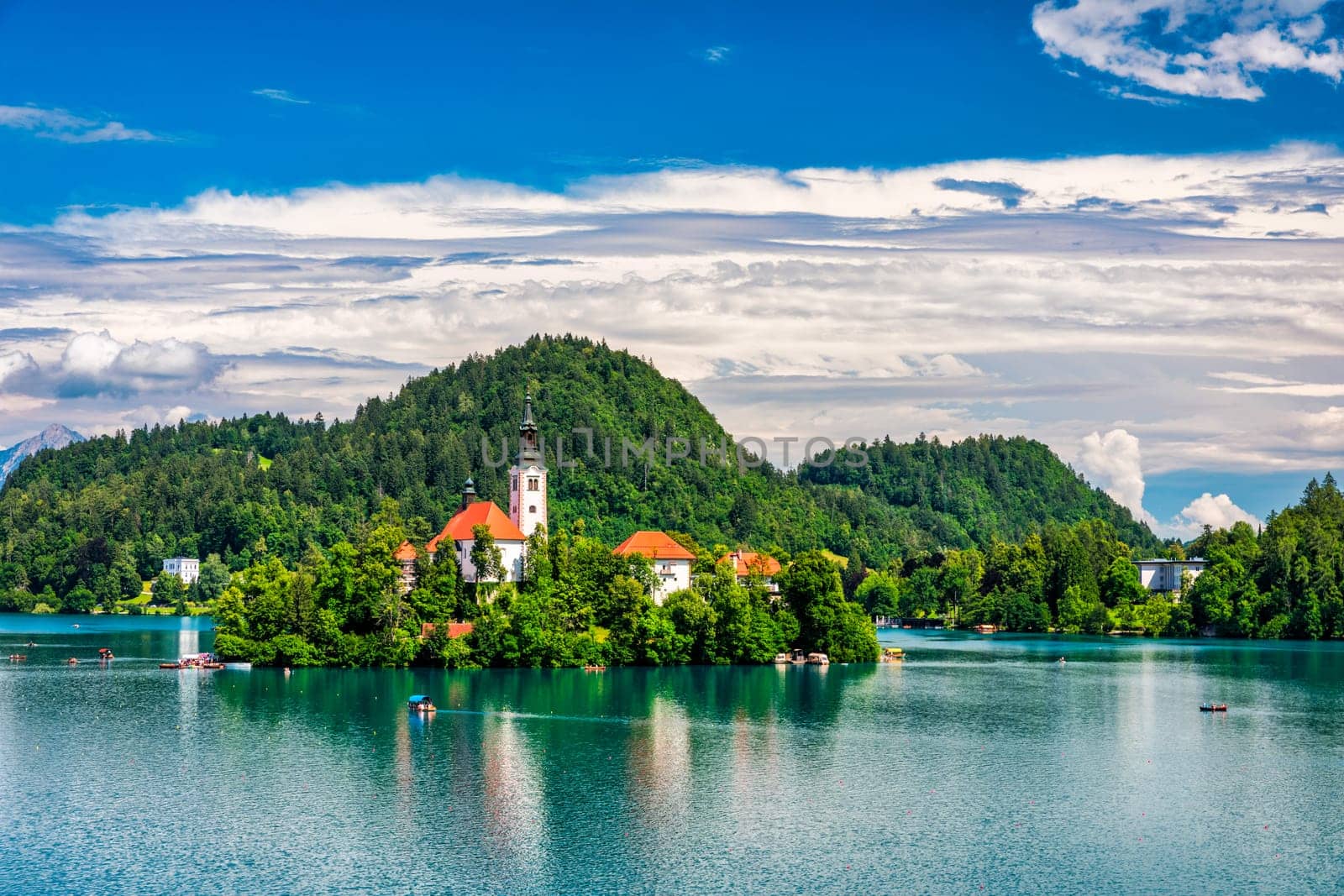 Lake Bled in Slovenia. Beautiful mountains and Bled lake with small Pilgrimage Church. Bled lake and island with Pilgrimage Church of the Assumption of Maria. Bled, Slovenia, Europe.