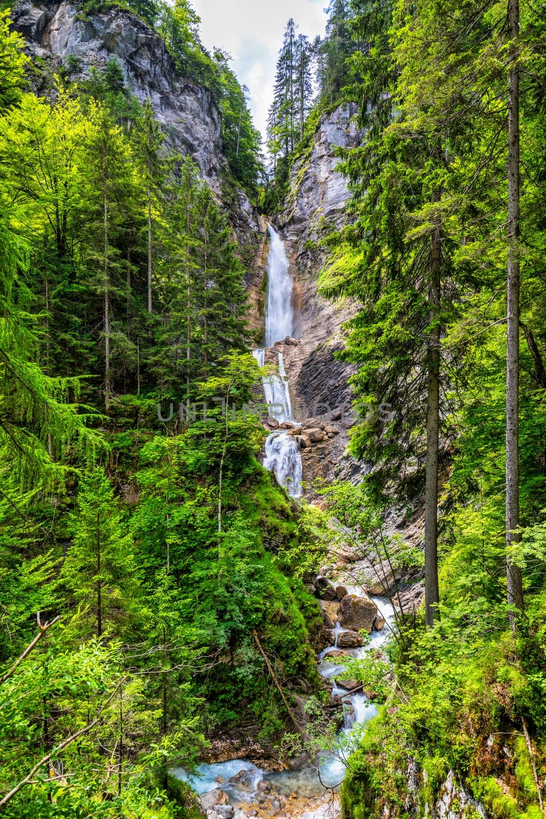 The beautiful three-part Lower Martuljek Waterfall in the Julian Alps, Slovenia. Triglav National Park. Scenic mountain with Martuljek waterfall in Triglav national park in Julian Alps, Slovenia.