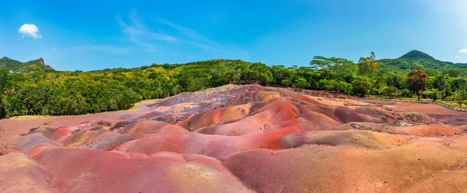 Chamarel Seven Colored Earth Geopark in Mauritius Island. Colorful panoramic landscape about this volcanic geological formation Chamarel Seven Colored Earth Geopark in Riviere noire district.