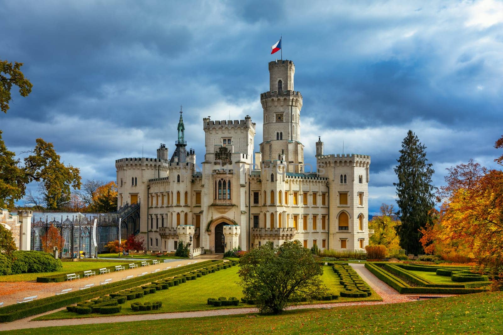 Castle Hluboka nad Vltavou is one of the most beautiful castles in Czech Republic. Castle Hluboka nad Vltavou in autumn with red foliage, Czechia. Colorful autumn view of Hluboka nad Vltavou castle.