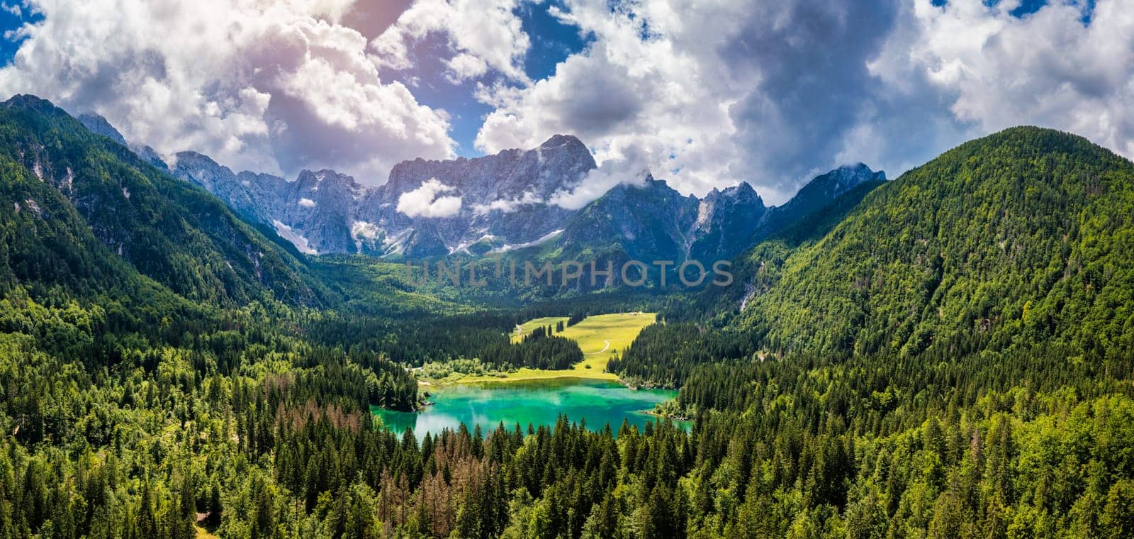 Lake of Fusine (Lago Superiore di Fusine) and the Mountain Range of Mount Mangart, Julian Alps, Tarvisio, Udine province, Friuli Venezia Giulia, Italy, Europe. Picturesque lake Lago Fusine in Italy.