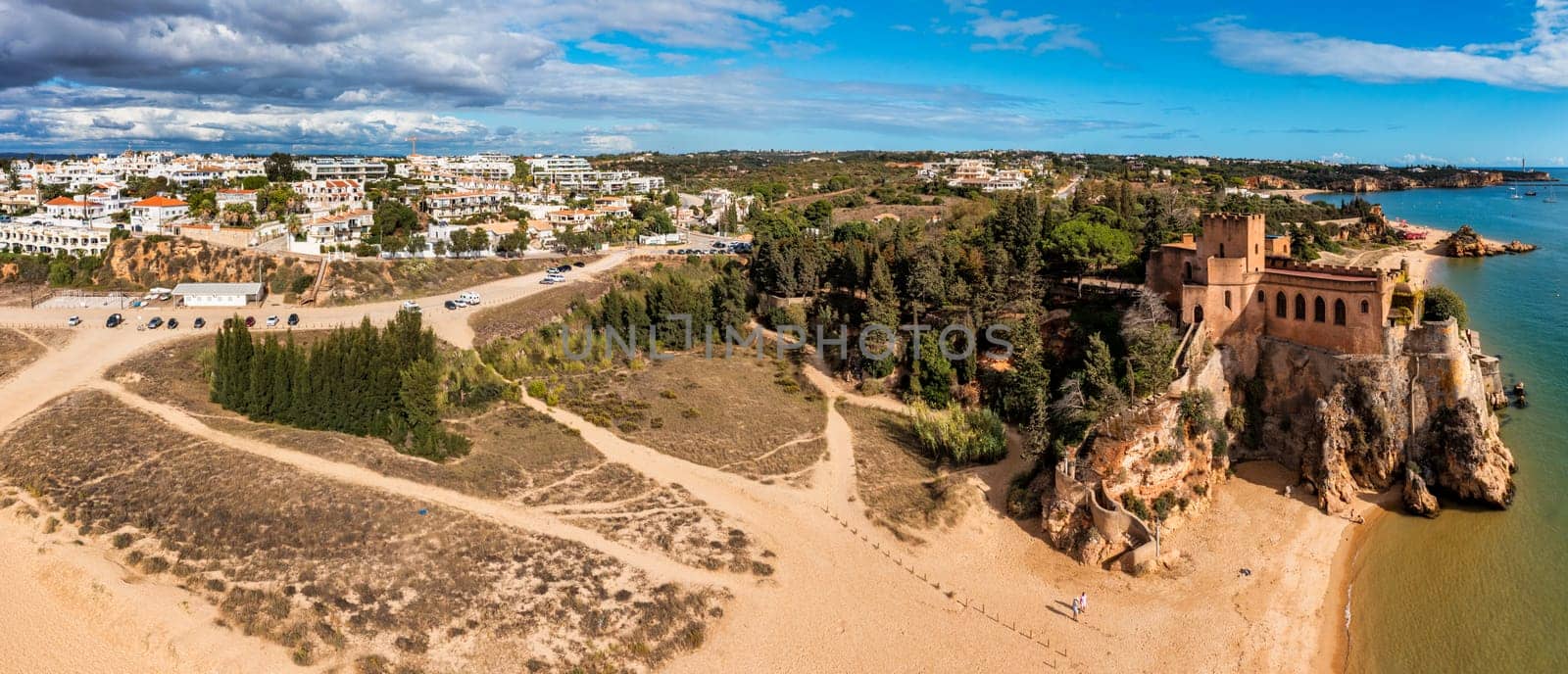 View of Ferragudo village in Algarve, Portugal. Old sea town of Ferragudo. View of Ferragudo from the air. Ferragudo is a beautiful coastal village in Algarve, Portugal, Europe.