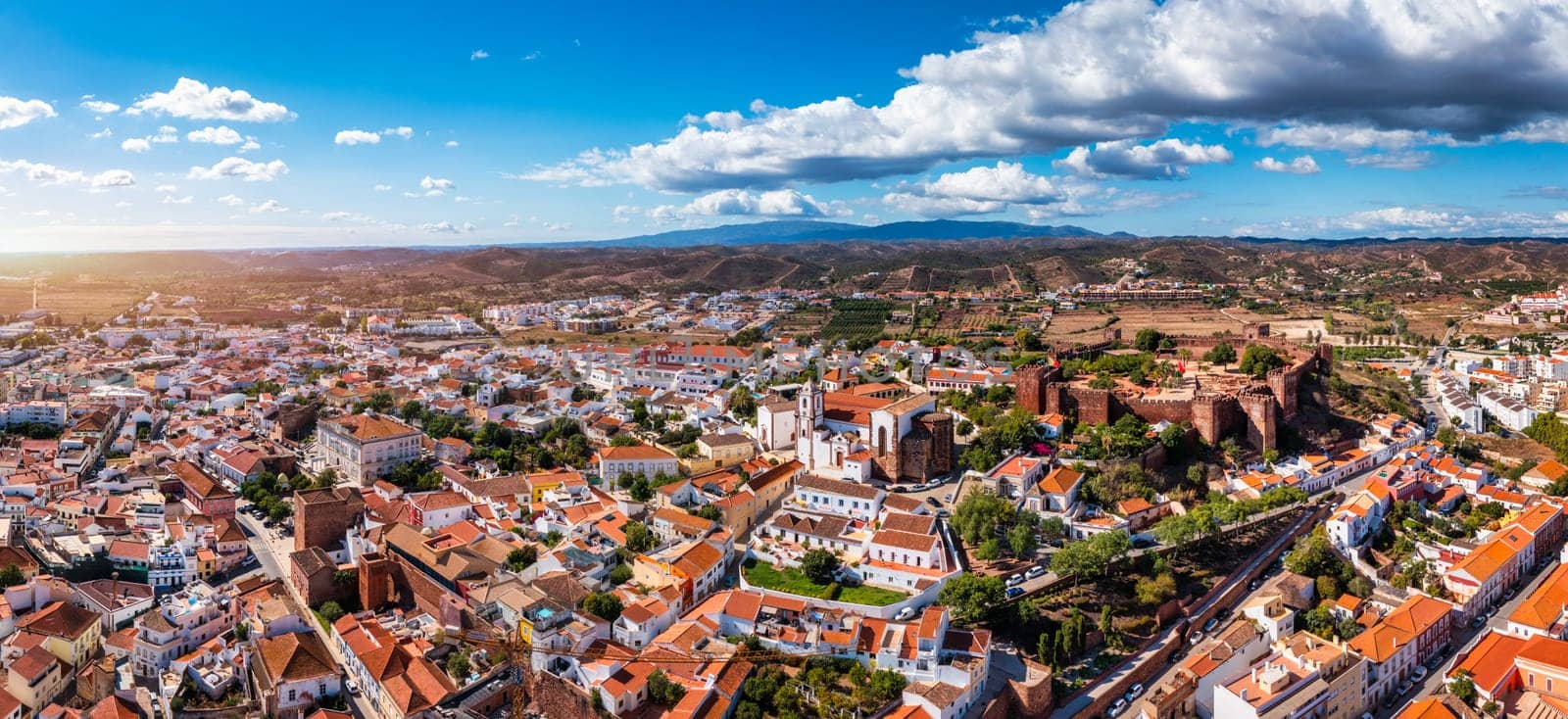 View of Silves town buildings with famous castle and cathedral, Algarve region, Portugal. Walls of medieval castle in Silves town, Algarve region, Portugal. 