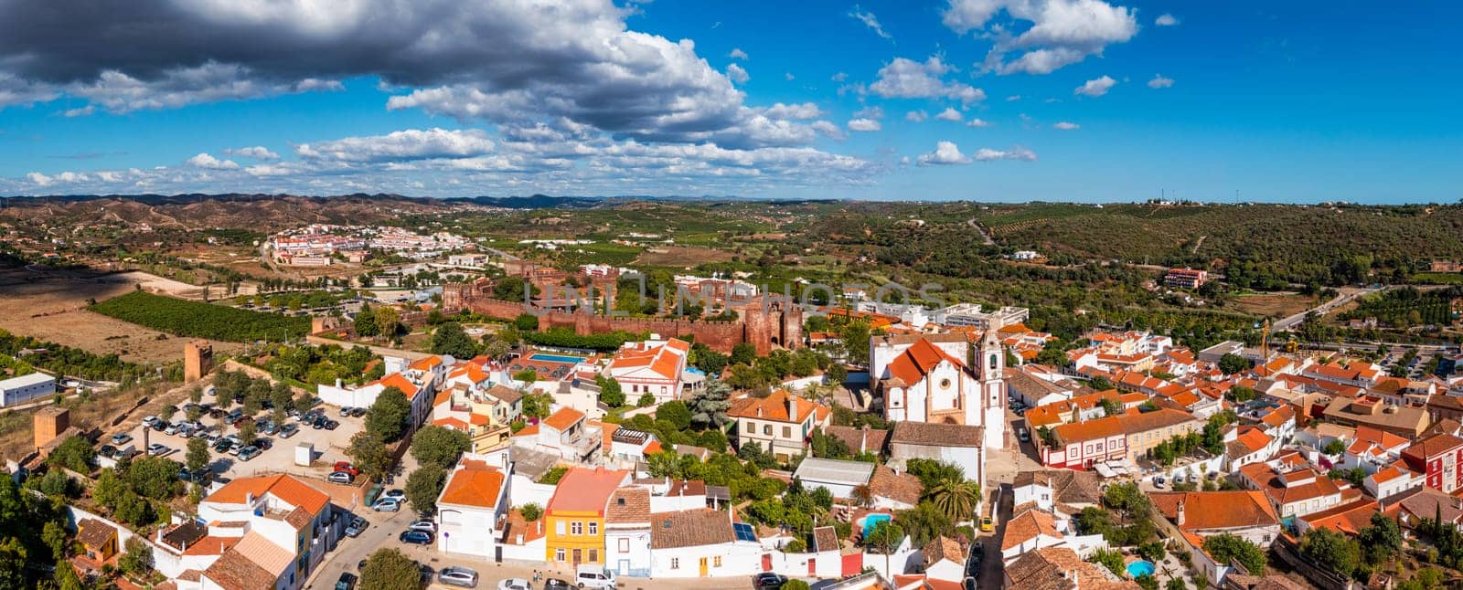 View of Silves town buildings with famous castle and cathedral, Algarve region, Portugal. Walls of medieval castle in Silves town, Algarve region, Portugal. 