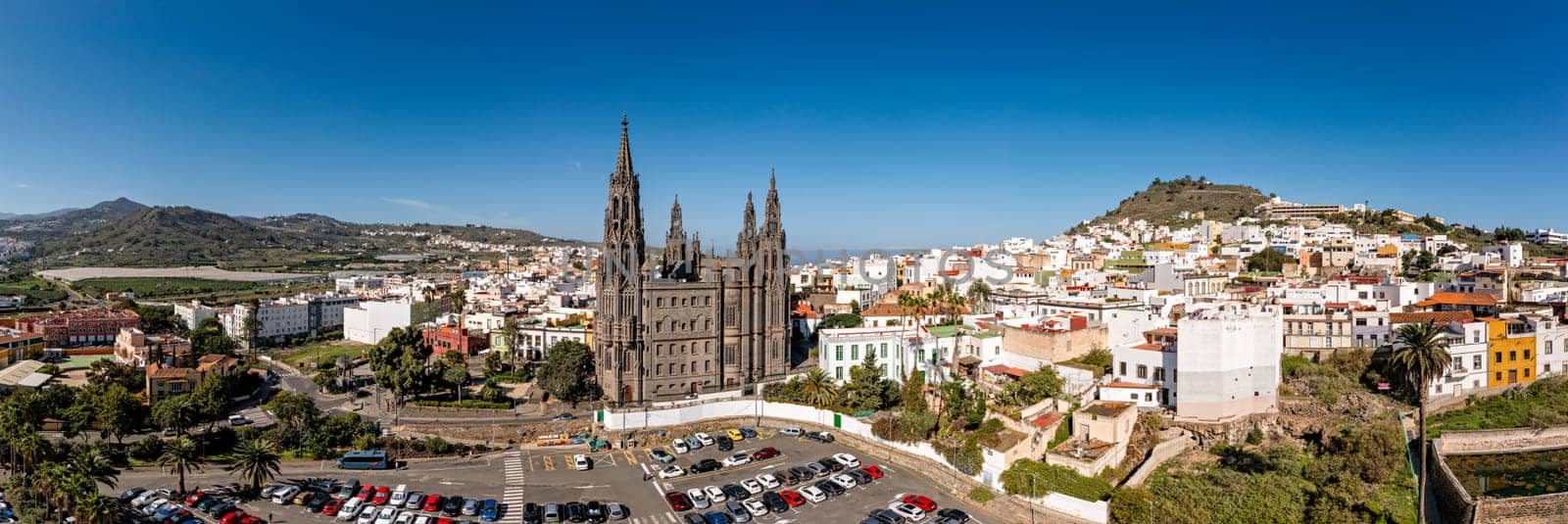 Aerial view of the Parroquia de San Juan Bautista de Arucas church in Arucas town, Gran Canaria, Canary Islands, Spain. Historic Neo-Gothic cathedral in Arucas. 