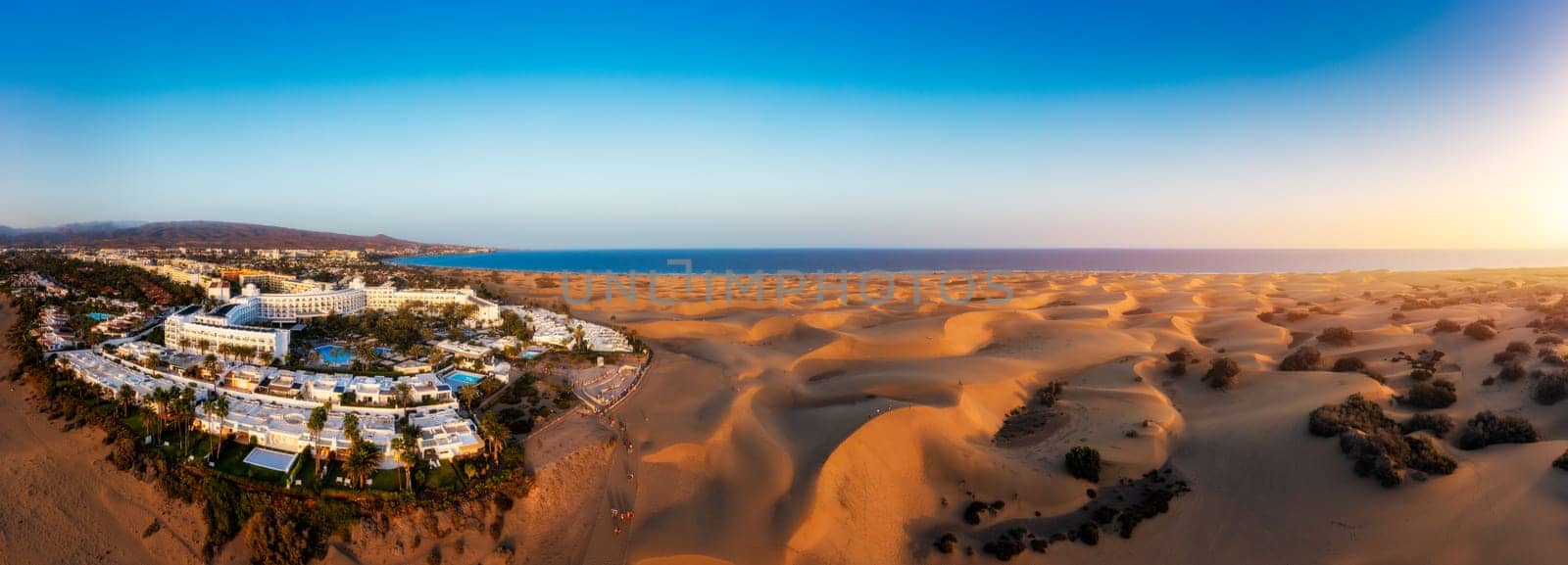 Landscape with Maspalomas town and golden sand dunes, Gran Canaria, Canary Islands, Spain. Natural Reserve of Dunes of Maspalomas, in Gran Canaria, Canary Islands, Spain.