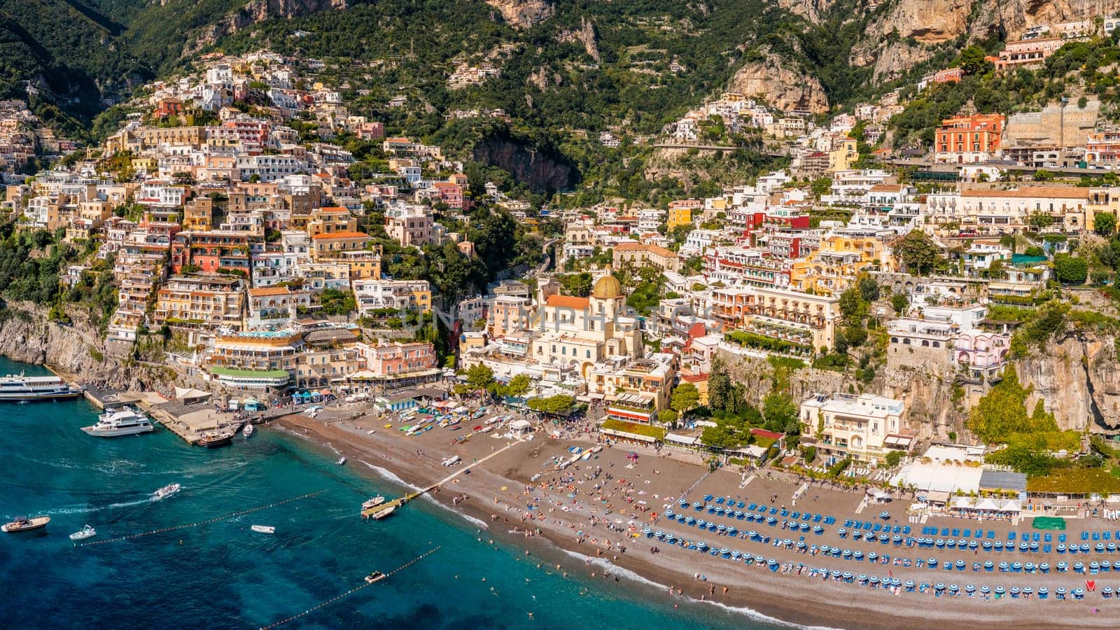 Aerial view of Positano with comfortable beach and blue sea on Amalfi Coast in Campania, Italy. Positano village on the Amalfi Coast, Salerno, Campania. Beautiful Positano, Amalfi Coast in Campania.