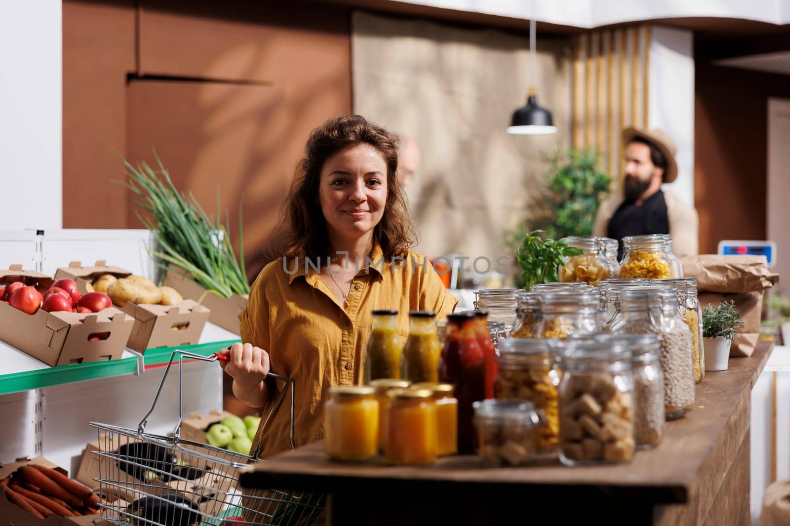 Woman buying fresh vegetables by DCStudio