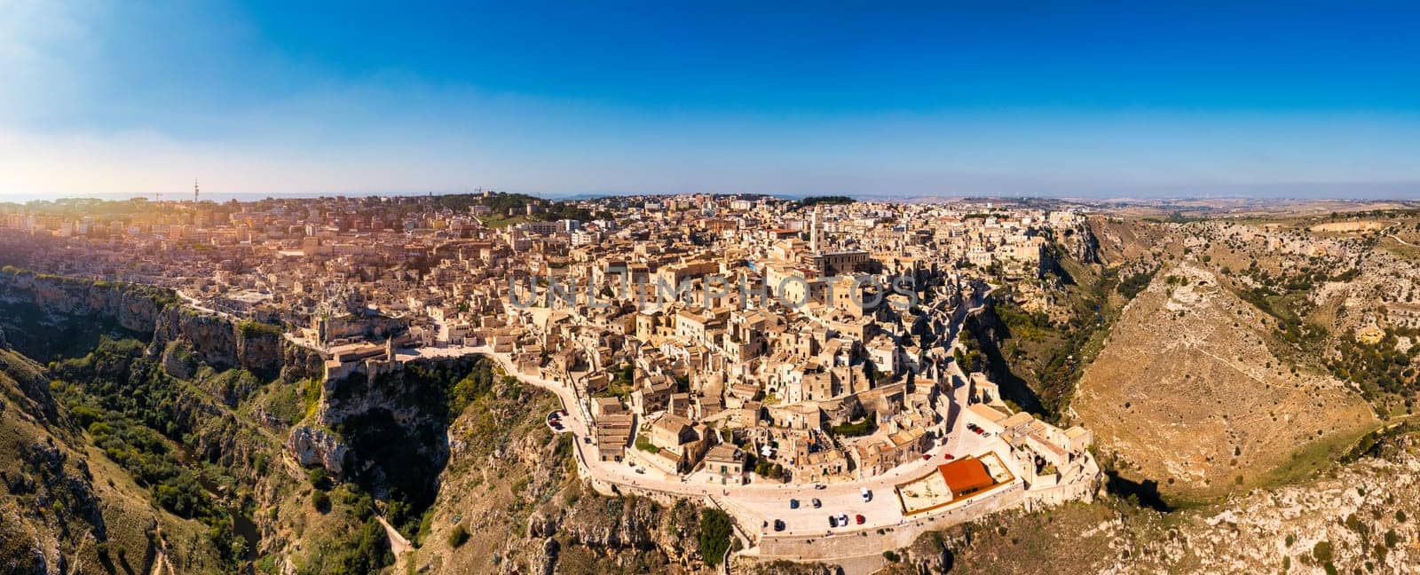 Panoramic view of the ancient town of Matera (Sassi di Matera) in a beautiful autumn day, Basilicata, southern Italy. Stunning view of the village of Matera. Matera is a city on a rocky outcrop.