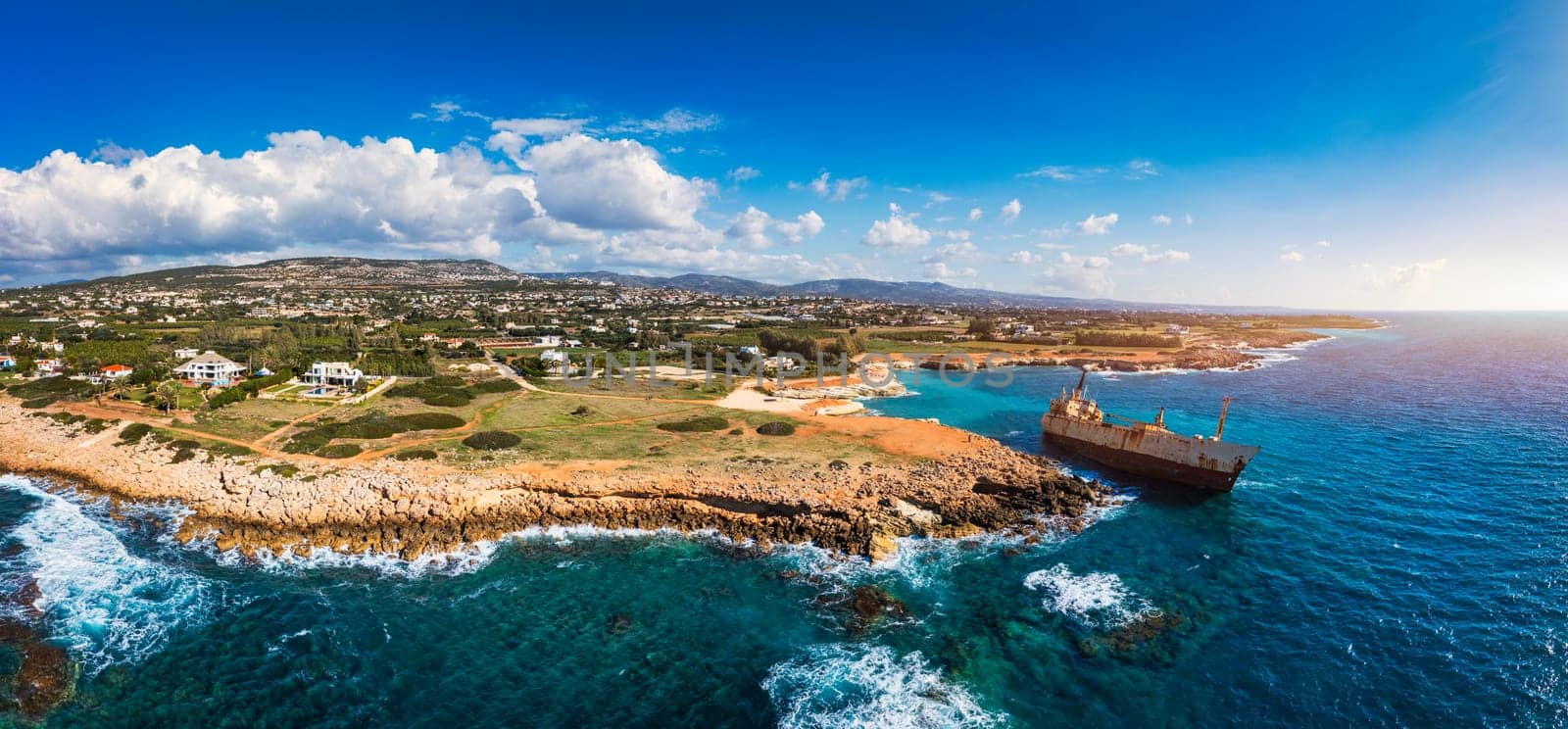 Abandoned Edro III Shipwreck at seashore of Peyia, near Paphos, Cyprus. Historic Edro III Shipwreck site on the shore of the water in Cyprus. Aerial view of Shipwreck EDRO III, Pegeia, Paphos.