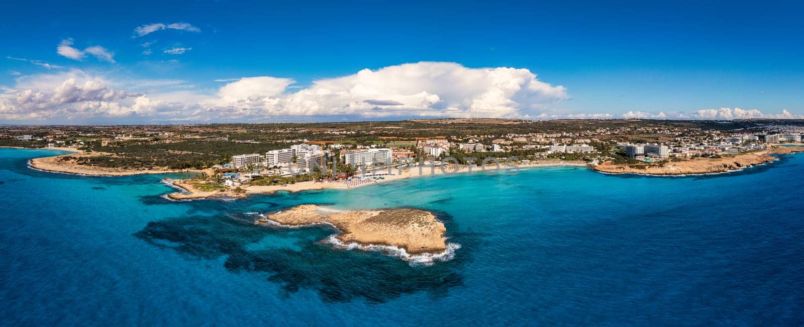 Aerial view of beautiful Nissi beach in Ayia Napa, Cyprus. Nissi beach in Ayia Napa famous tourist beach in Cyprus. A view of a azzure water and Nissi beach in Aiya Napa, Cyprus.