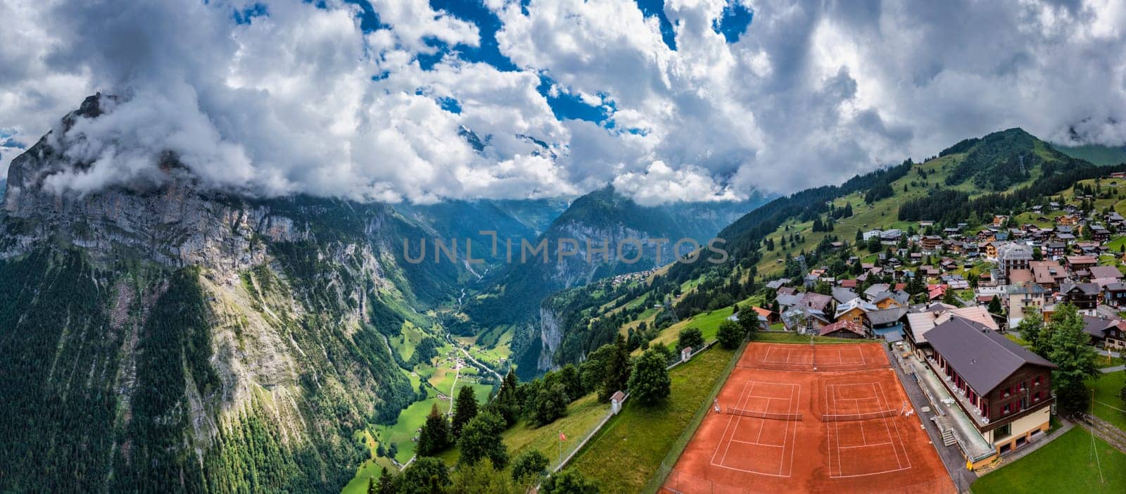 Village of Murren in the Swiss Alps. Village Murren surrounded by mountain peaks of Alps. Murren mountain village with Lauterbrunnen Valley and Swiss Alps, Jungfrau region, Switzerland, Europe. 