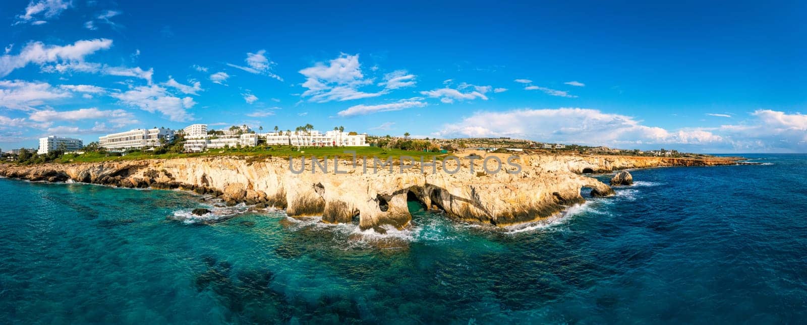 Beautiful bridge of lovers natural rock arch near of Ayia Napa, Cavo Greco and Protaras on Cyprus island, Mediterranean Sea. Legendary bridge lovers. Amazing blue green sea and sunny day