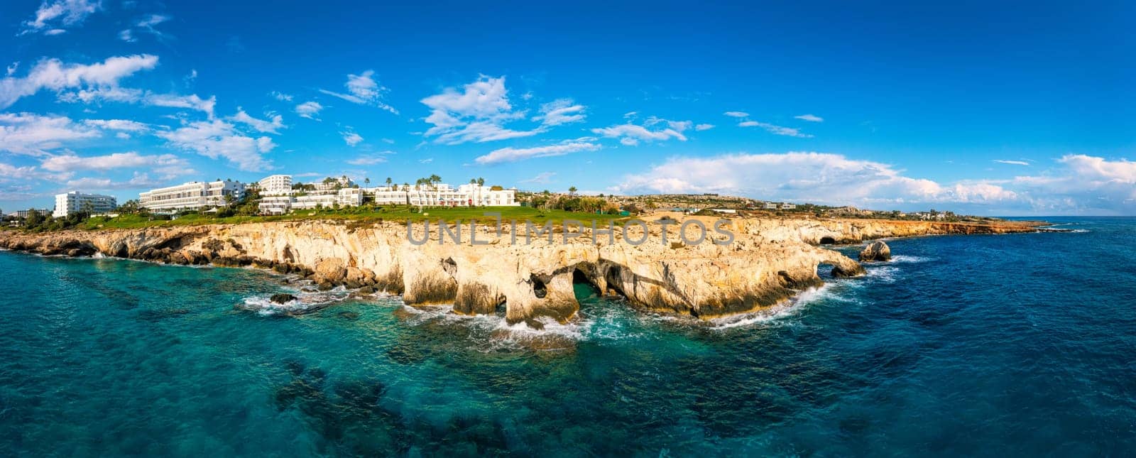 Beautiful bridge of lovers natural rock arch near of Ayia Napa, Cavo Greco and Protaras on Cyprus island, Mediterranean Sea. Legendary bridge lovers. Amazing blue green sea and sunny day