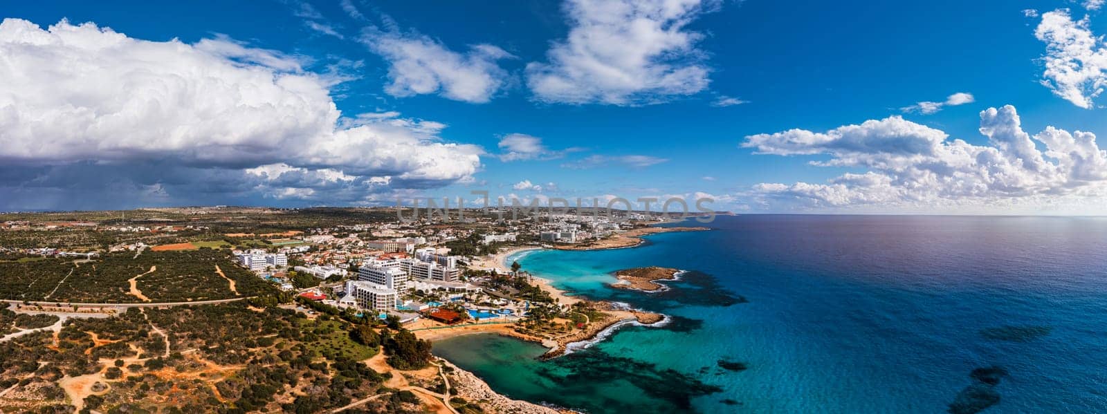 Aerial view of beautiful Nissi beach in Ayia Napa, Cyprus. Nissi beach in Ayia Napa famous tourist beach in Cyprus. A view of a azzure water and Nissi beach in Aiya Napa, Cyprus.