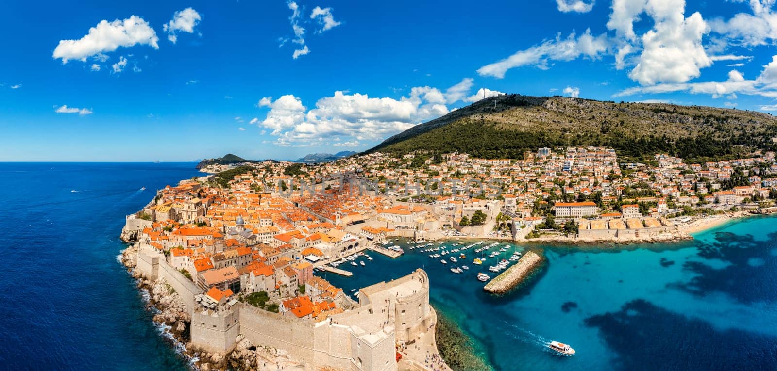 Dubrovnik a city in southern Croatia fronting the Adriatic Sea, Europe. Old city center of famous town Dubrovnik, Croatia. Picturesque view on Dubrovnik old town (medieval Ragusa) and Dalmatian Coast.