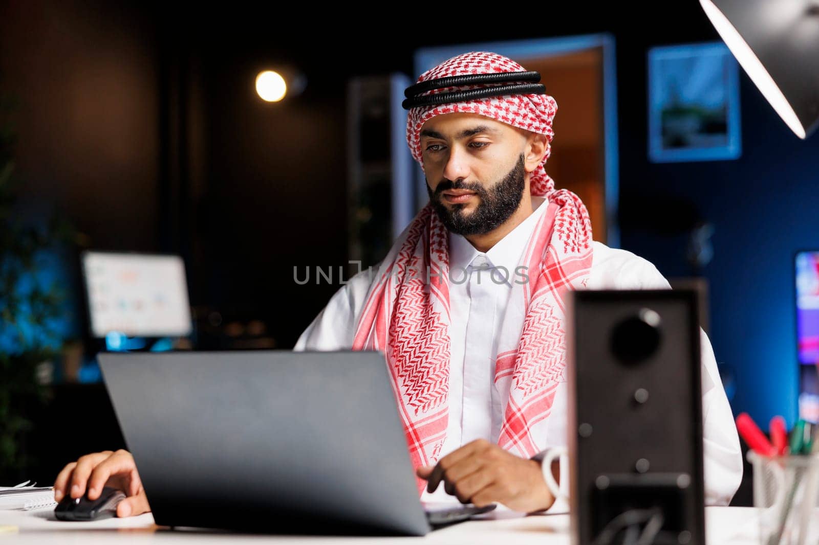 Arab businessman at modern office by DCStudio