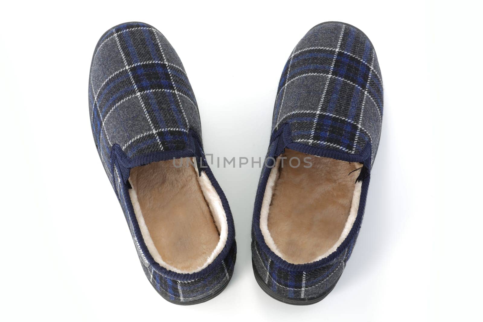 A top view of mens slippers on white background