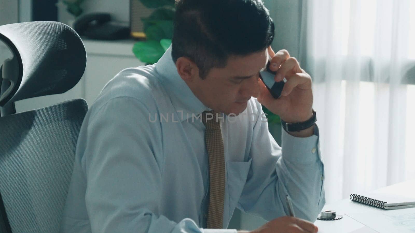 Civil engineer calling project manager about turbine engine structure while looking at tablet displayed electrical generator. Professional technician talking to team about jet engine. Alimentation.