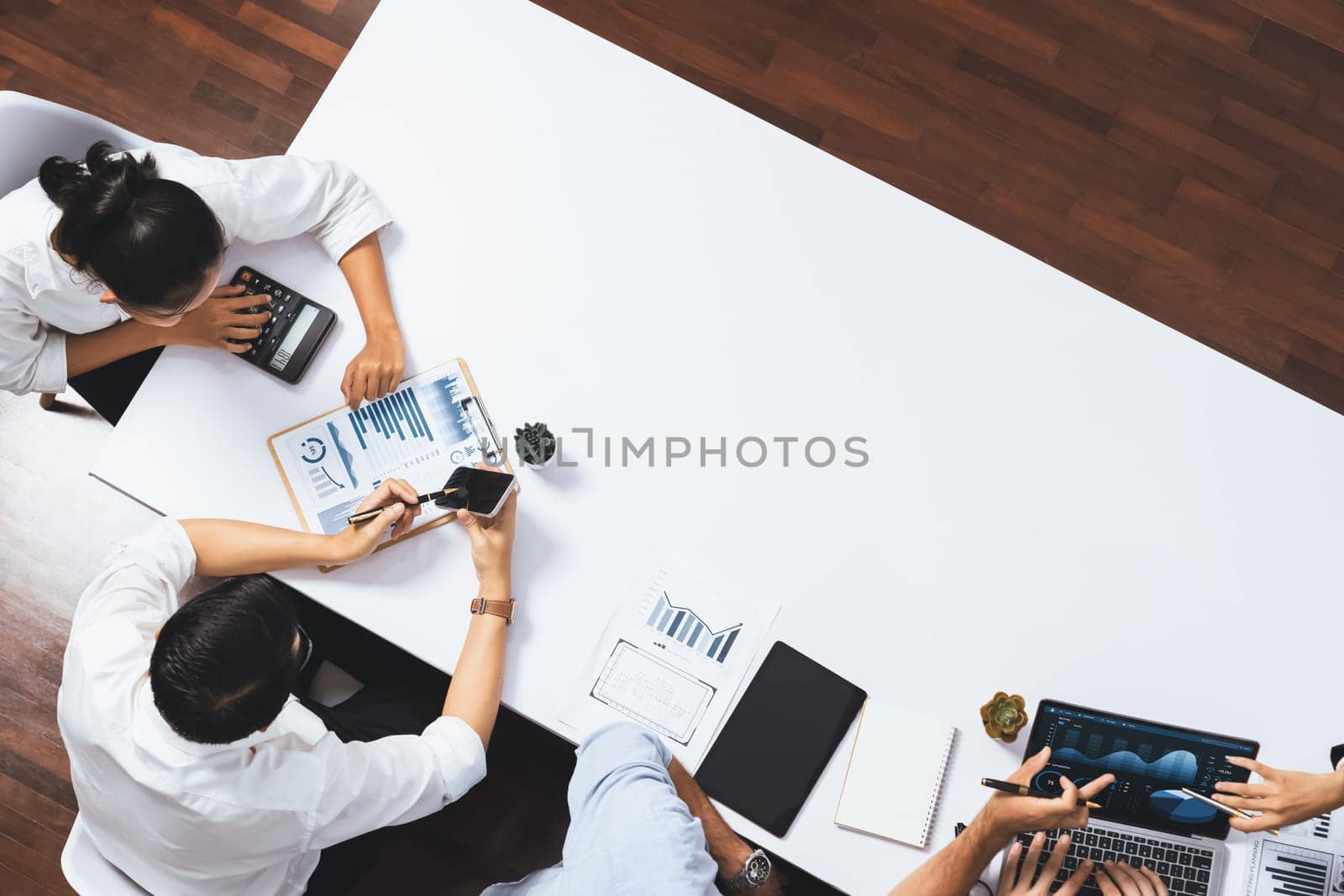Group of office worker and businesspeople working on business financial data analysis. Empty space with editable blank background meeting table for customer design. Prudent