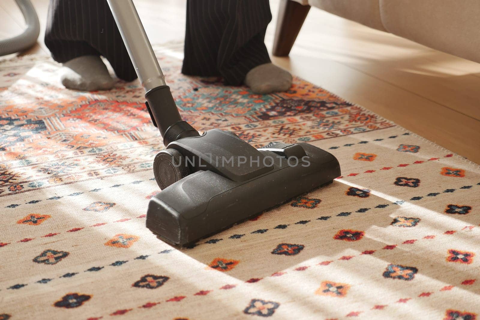 women cleaning with vacuum cleaner carpet