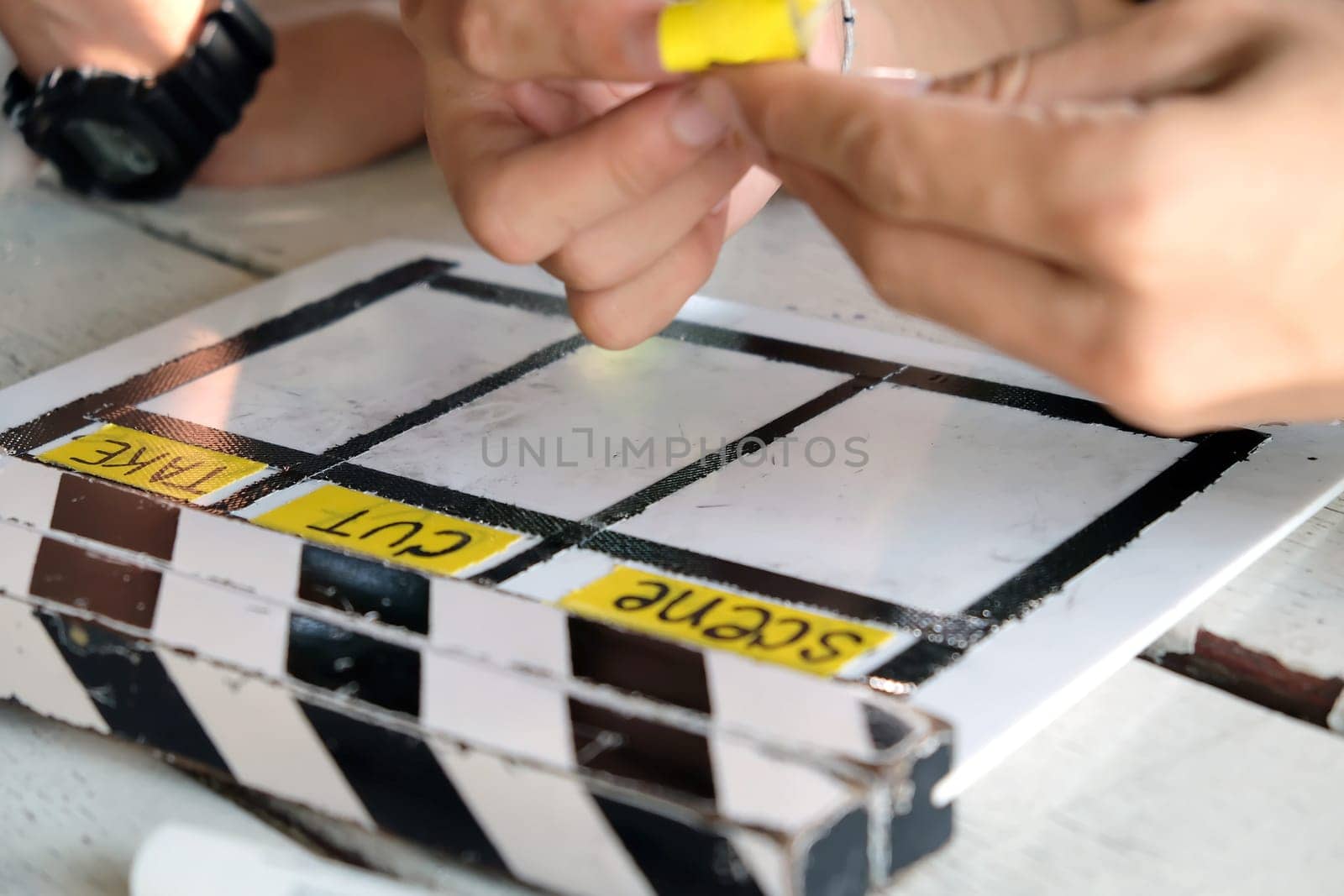 Film production crew, close up of movie Clapper board