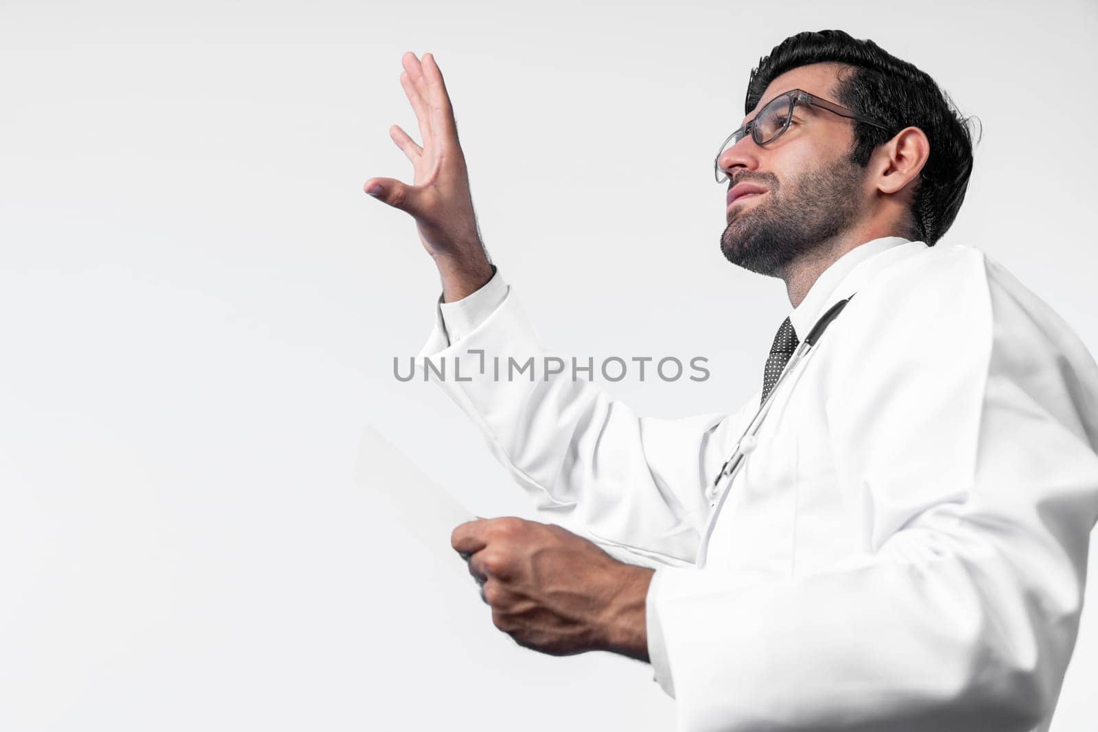 Side view of smart doctor pointing and checking and looking at chart or application form. Professional doctor diagnosis and analysis medical data while wearing lab coat and stethoscope. Deviation.