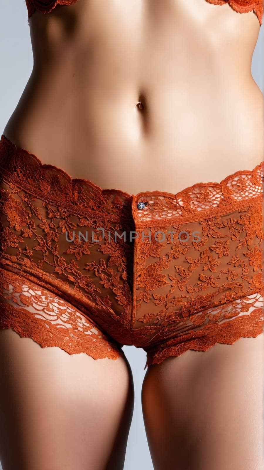 Lace Rust Boyshorts Vintage inspired rust lace boyshorts with a scalloped waistband and a cheeky cut. Close up portrait in studio