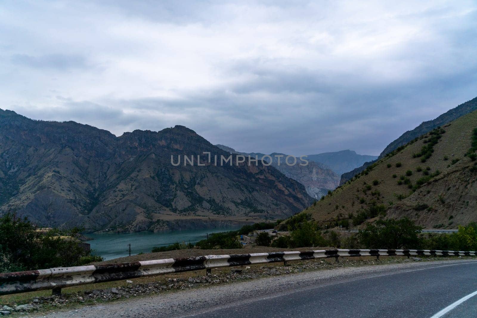 View from the car of an asphalt road in the mountainous area of Dagestan.