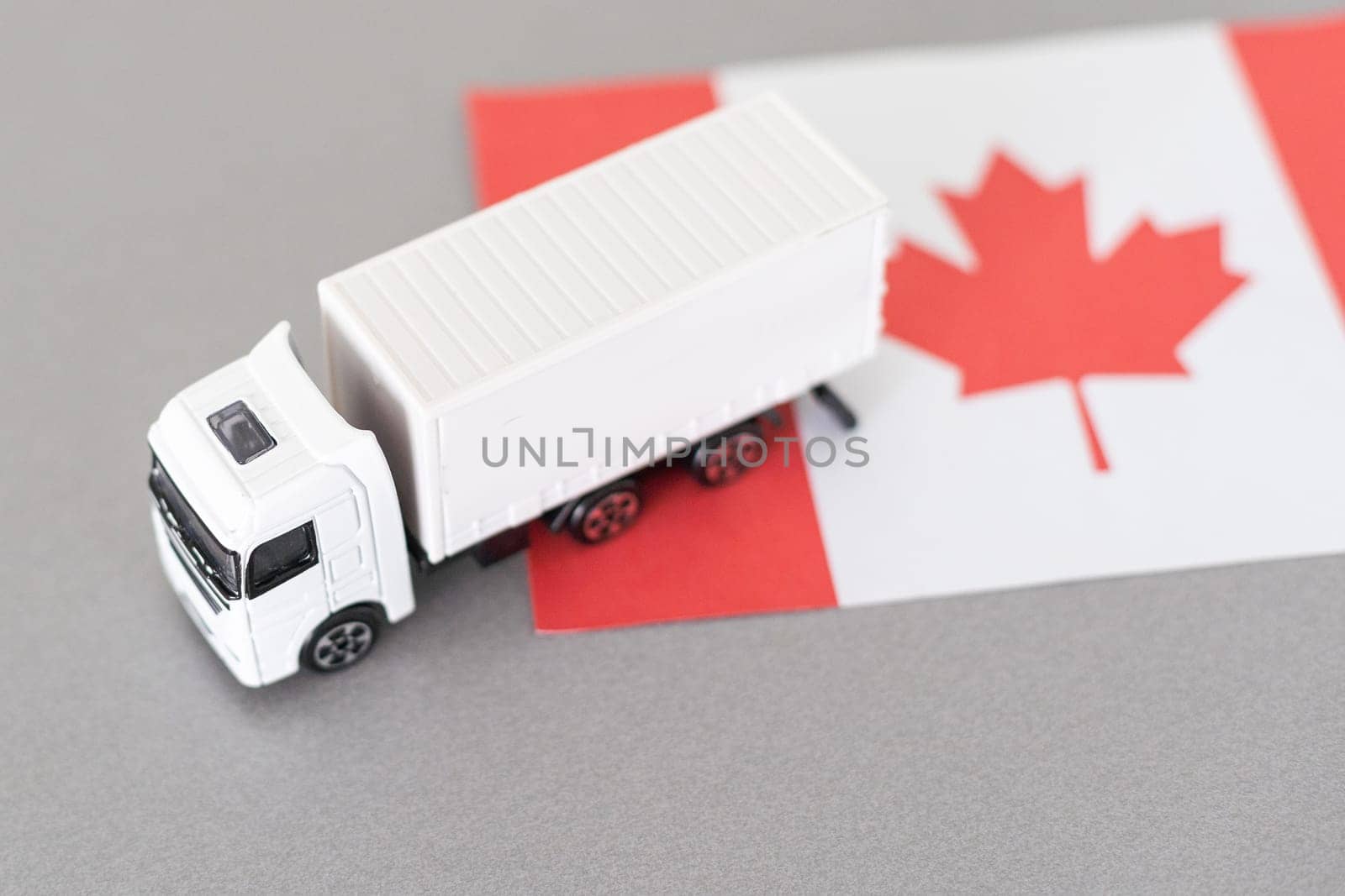 Symbol of National Delivery Truck with Flag of Canada. National Trucking Icon and Canadian flag by Andelov13