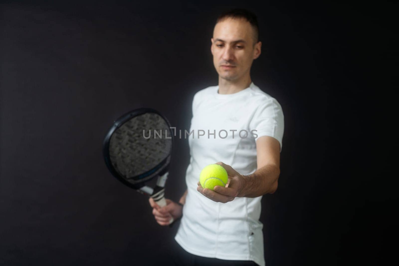 Young man playing the paddle. High quality photo