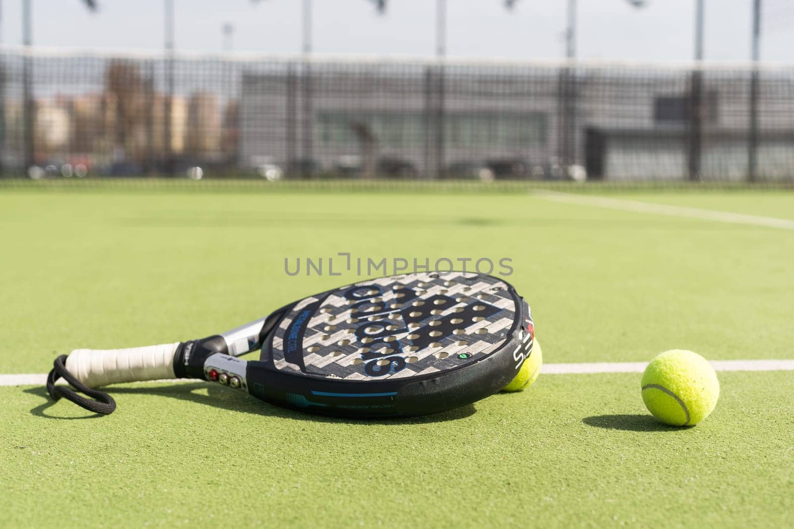 Ukraine Kyiv, April 02 2024. Paddle tennis racket and ball. High quality photo