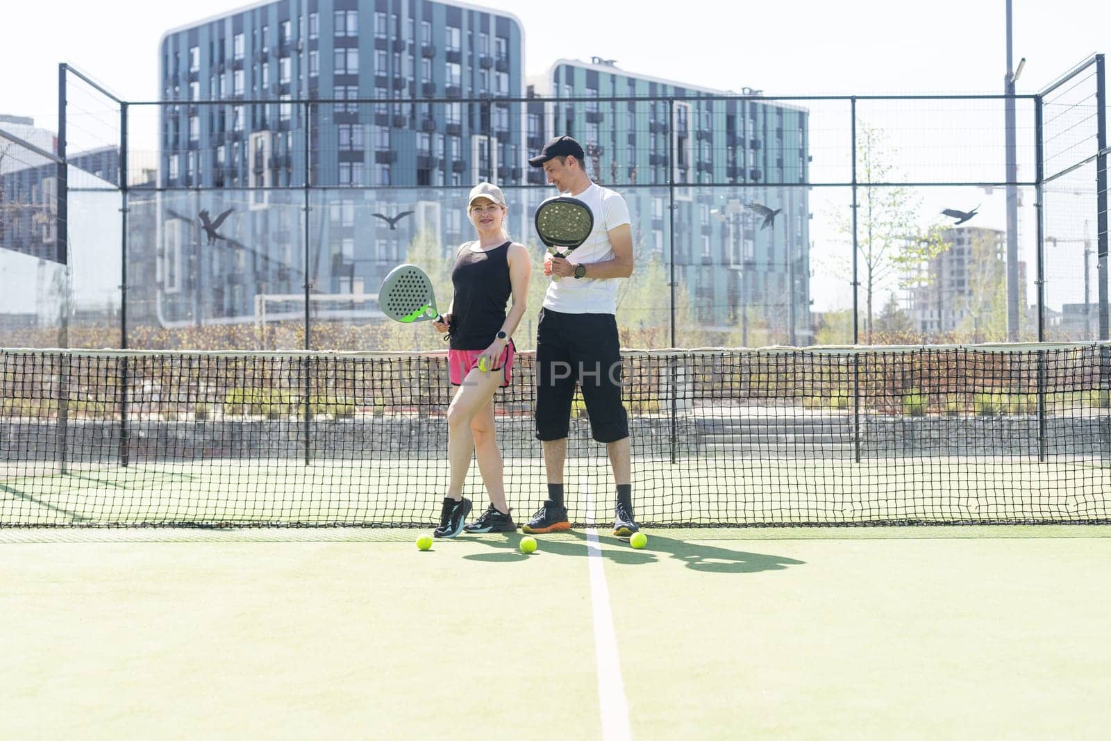 paddle tennis couple players ready for class. High quality photo