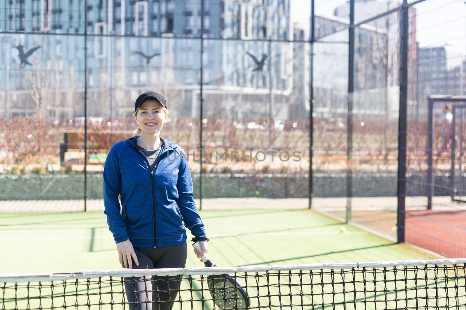 One women playing Paddle tennis. High quality photo