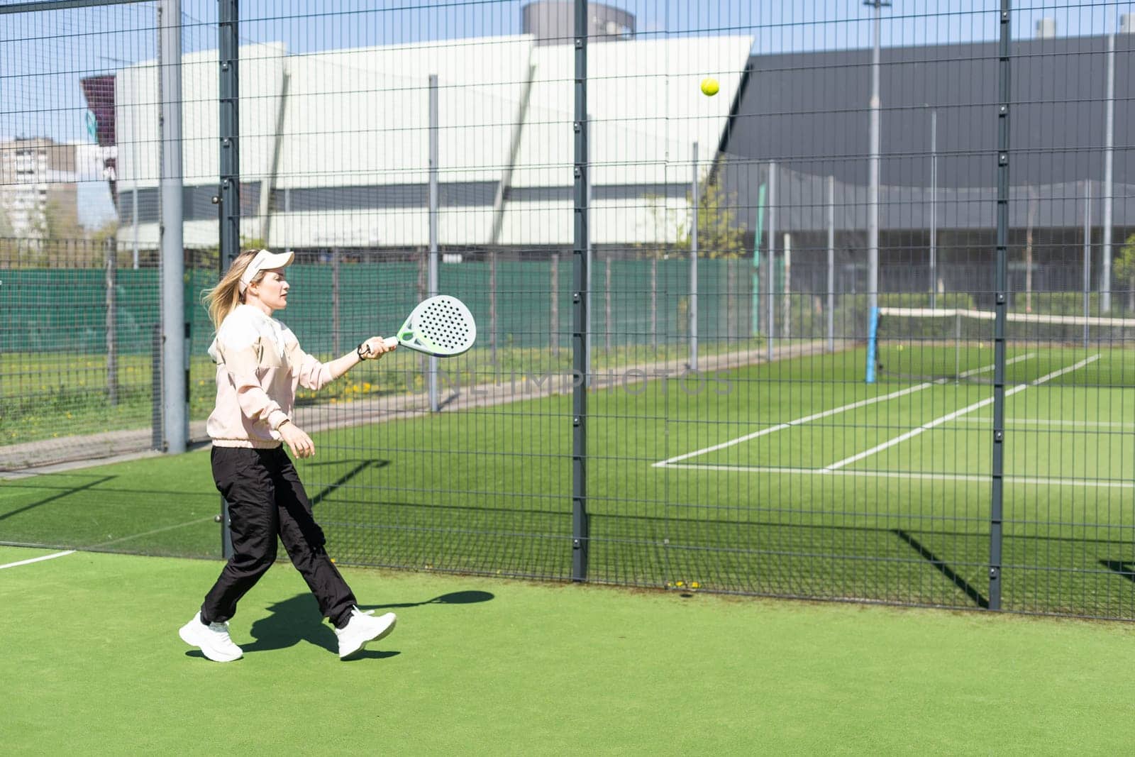 One women playing Paddle tennis. High quality photo