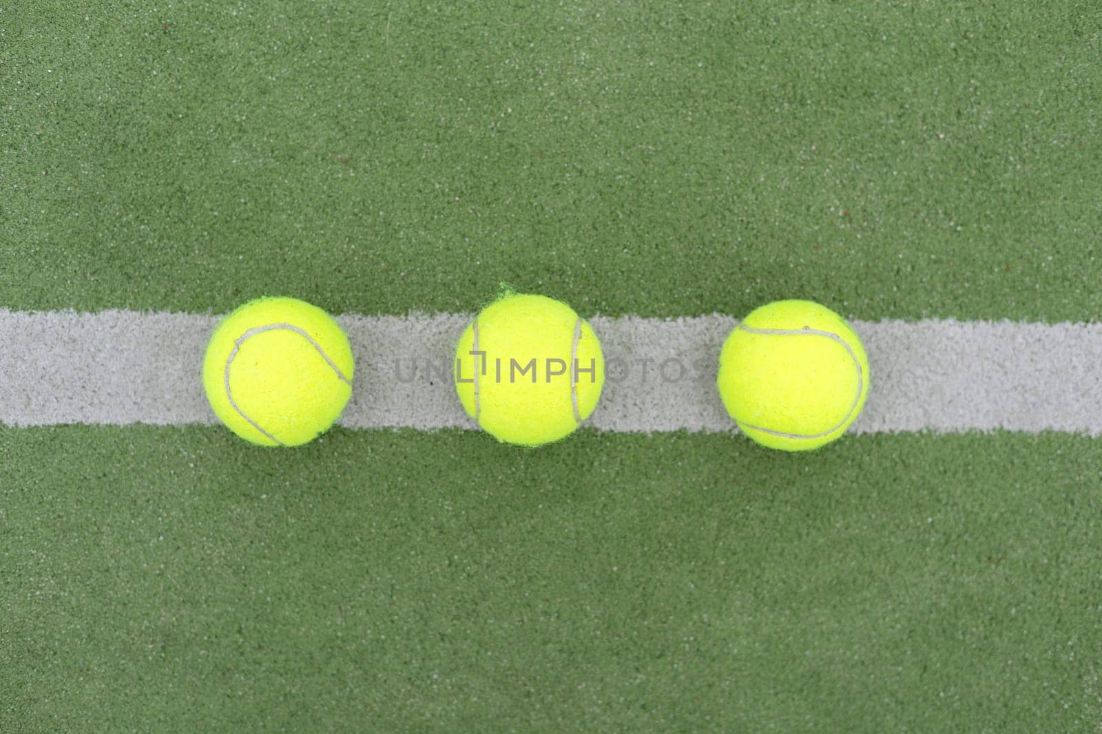 Tennis ball on green grass by Andelov13