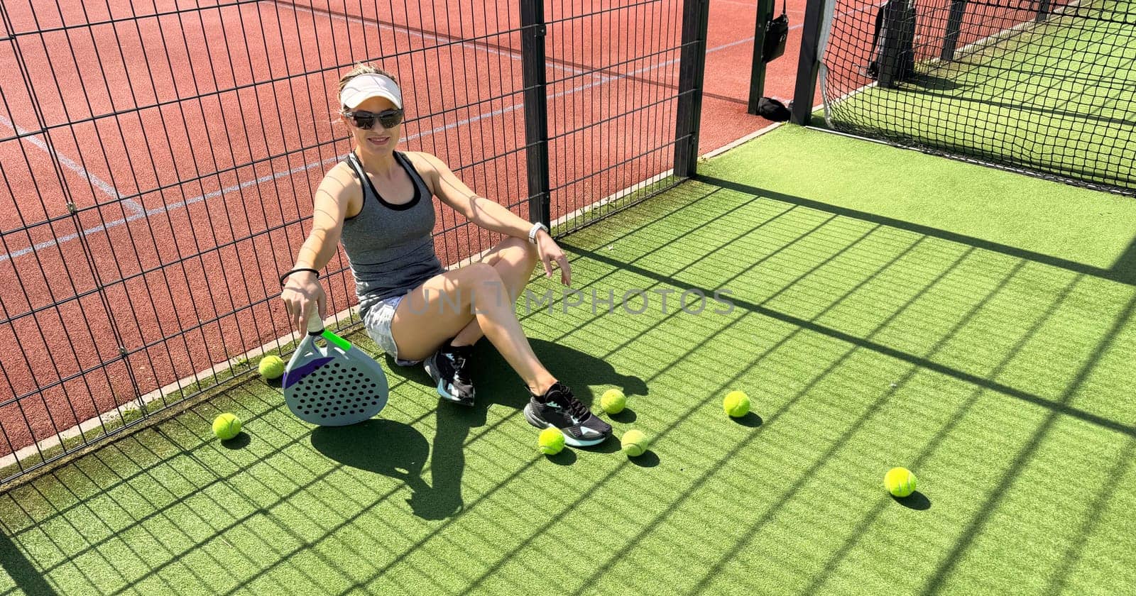 Woman players serving ball. Young adult girl play tennis outside arena. Person racket beat game club. People group hit sport court match. Fit care free time. Run skill train. Padel tennis team workout. High quality FullHD footage