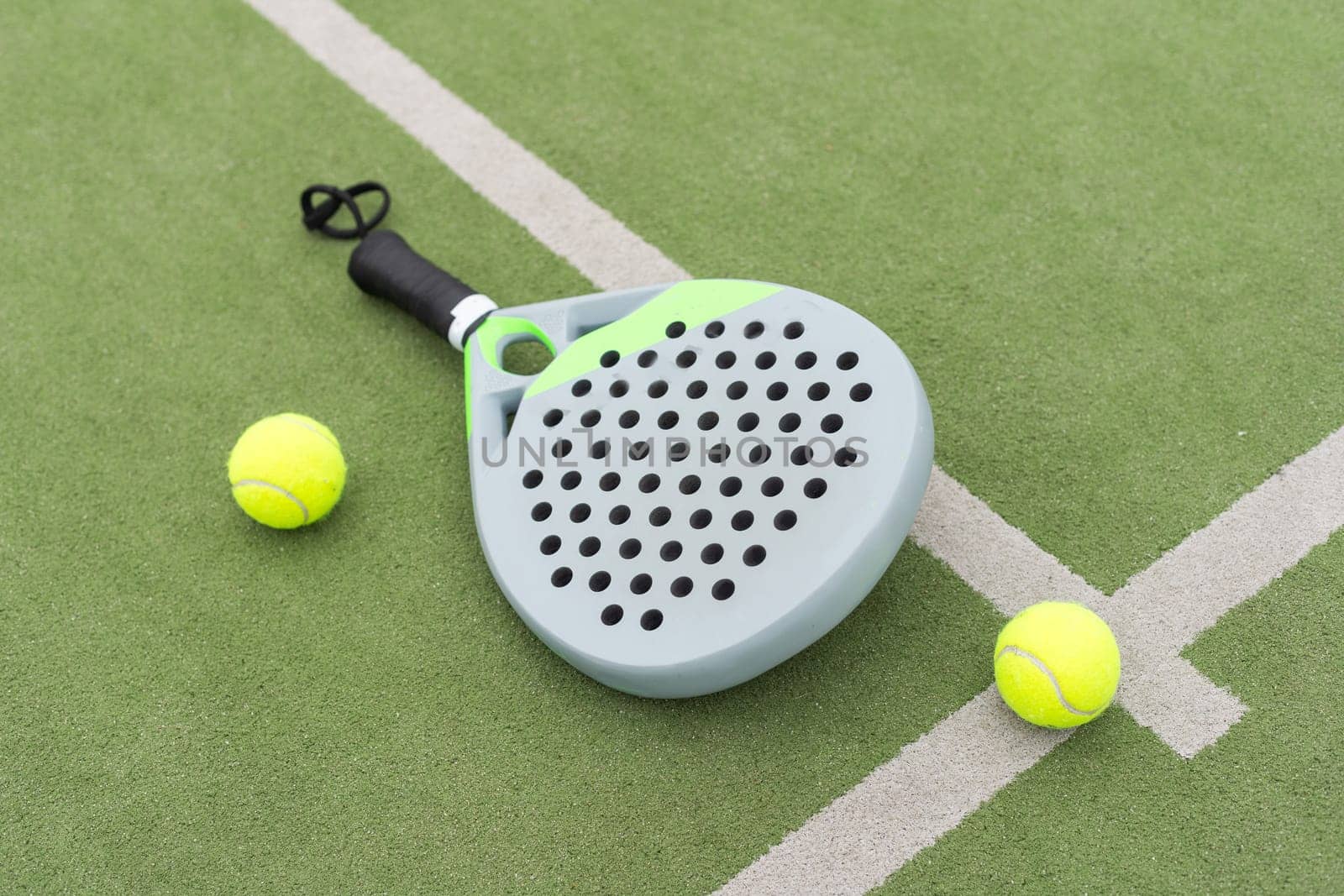 Paddle tennis objects on grass court. High quality photo