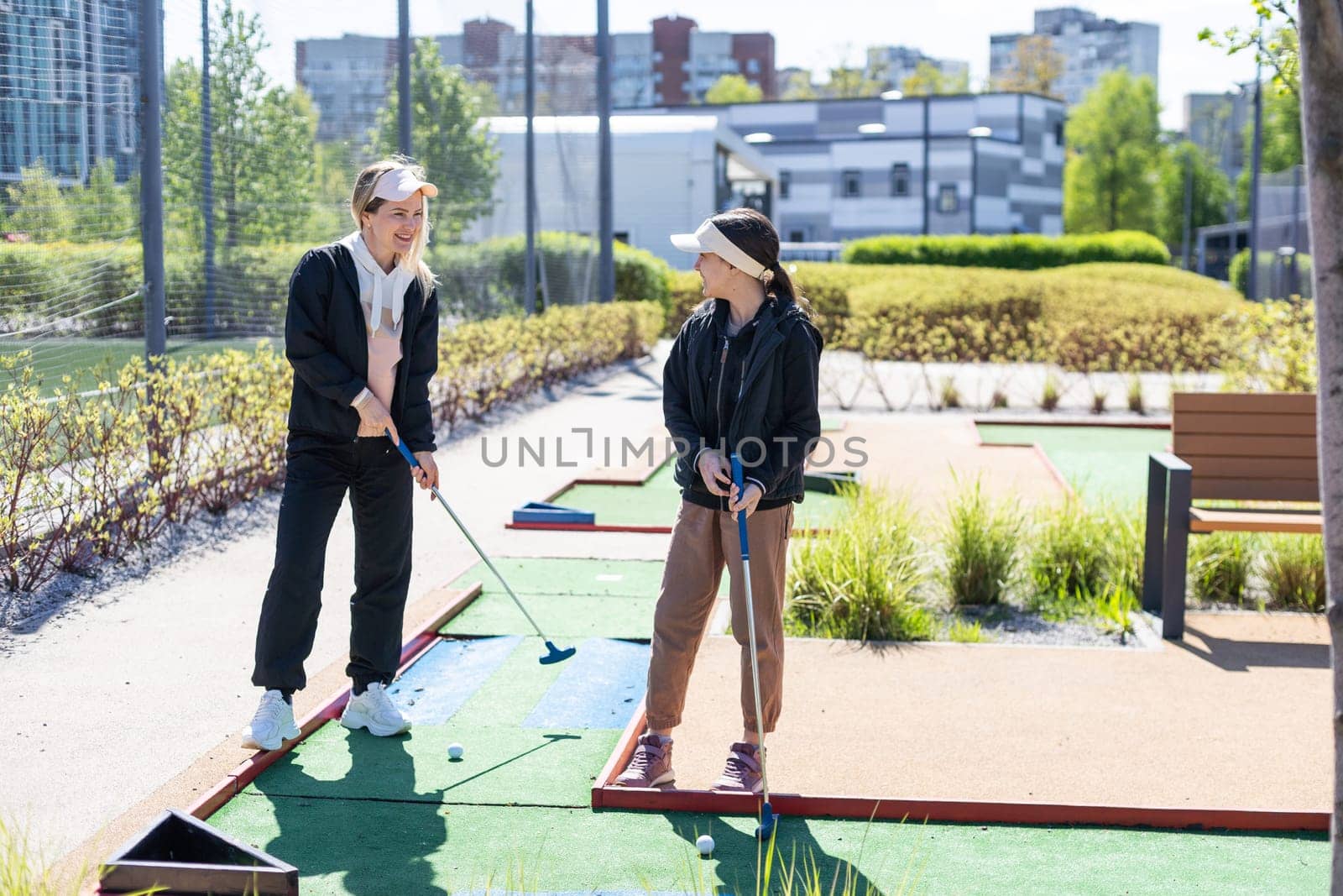 cute little girl on a miniature golf course. High quality photo