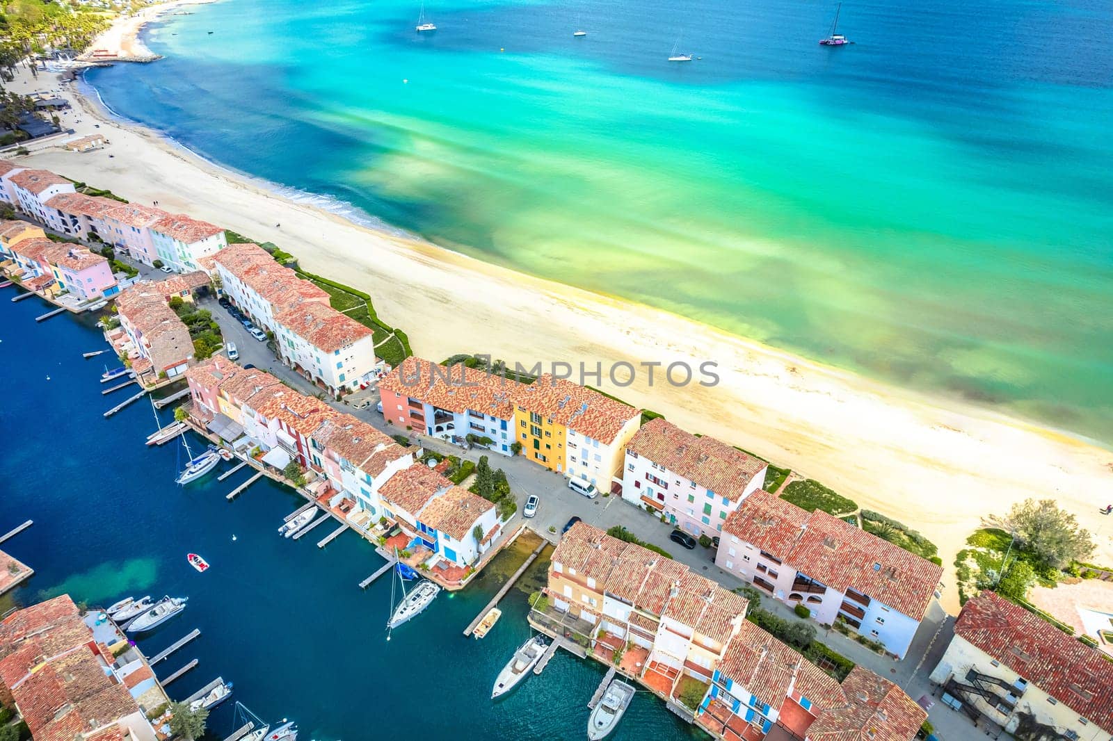 Scenic Port Grimaud yachting village marina and beach aerial view, archipelago of French riviera