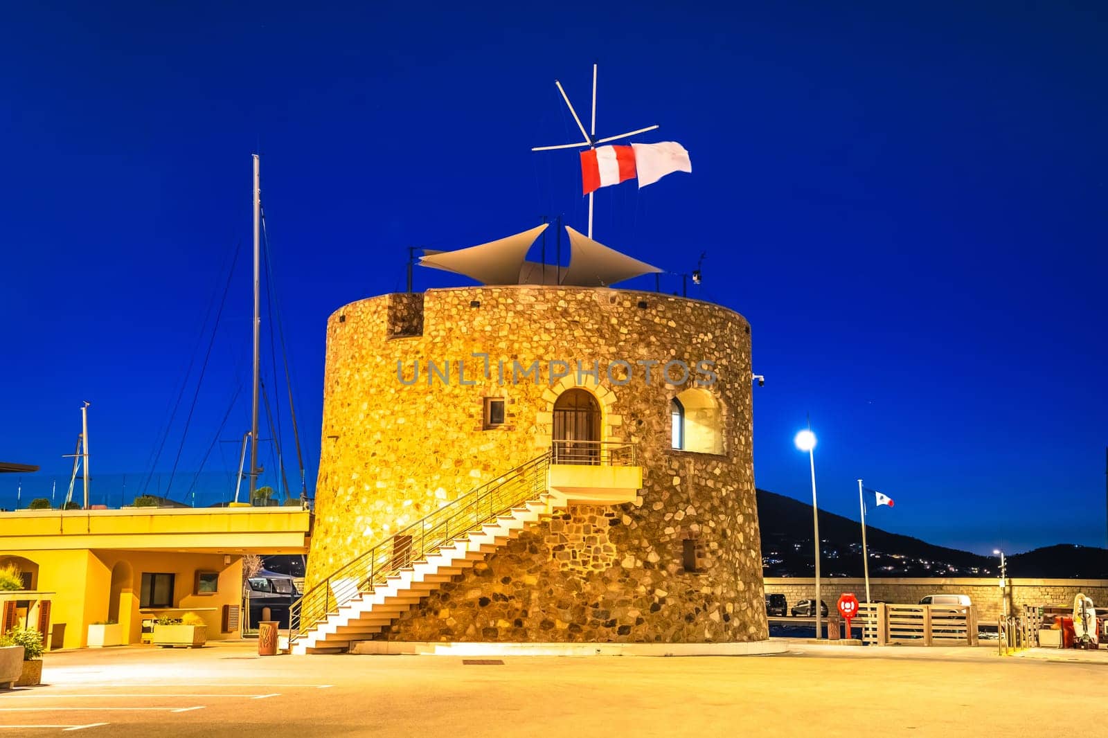 Saint Tropez village yachting harbor tower evening view, famous tourist destination by xbrchx